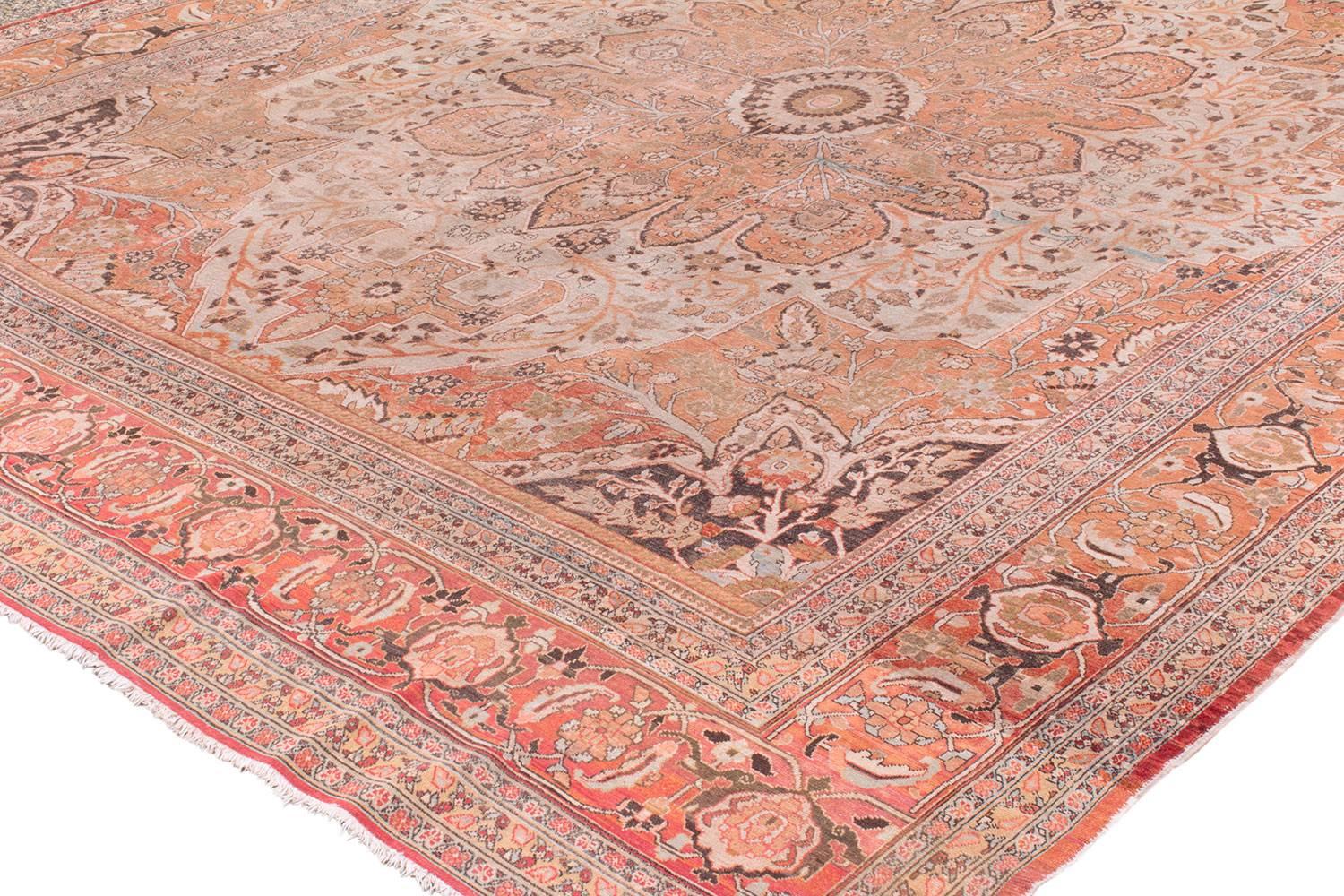 This Tabriz carpet has very nice design elements, The branches and leaves look like they are swaying in the breeze. The salmon pink colors are so soft and calming. There are little touches of very light blue that accentuate the rug perfectly. One of