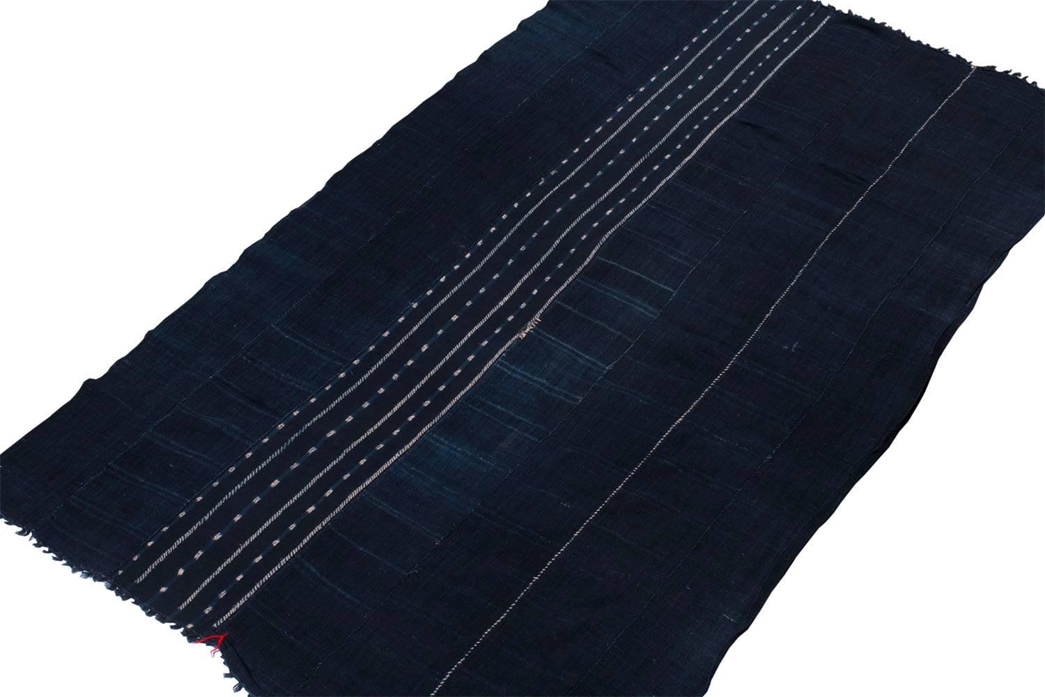 We are not sure exactly who made this wrap, it certainly is from West Africa- perhaps Burkina Faso.
An intriguing piece, with luminous indigo, very soft hand spun cotton and a minimalist pattern. Even the stitching is artistic!
Finished nicely on