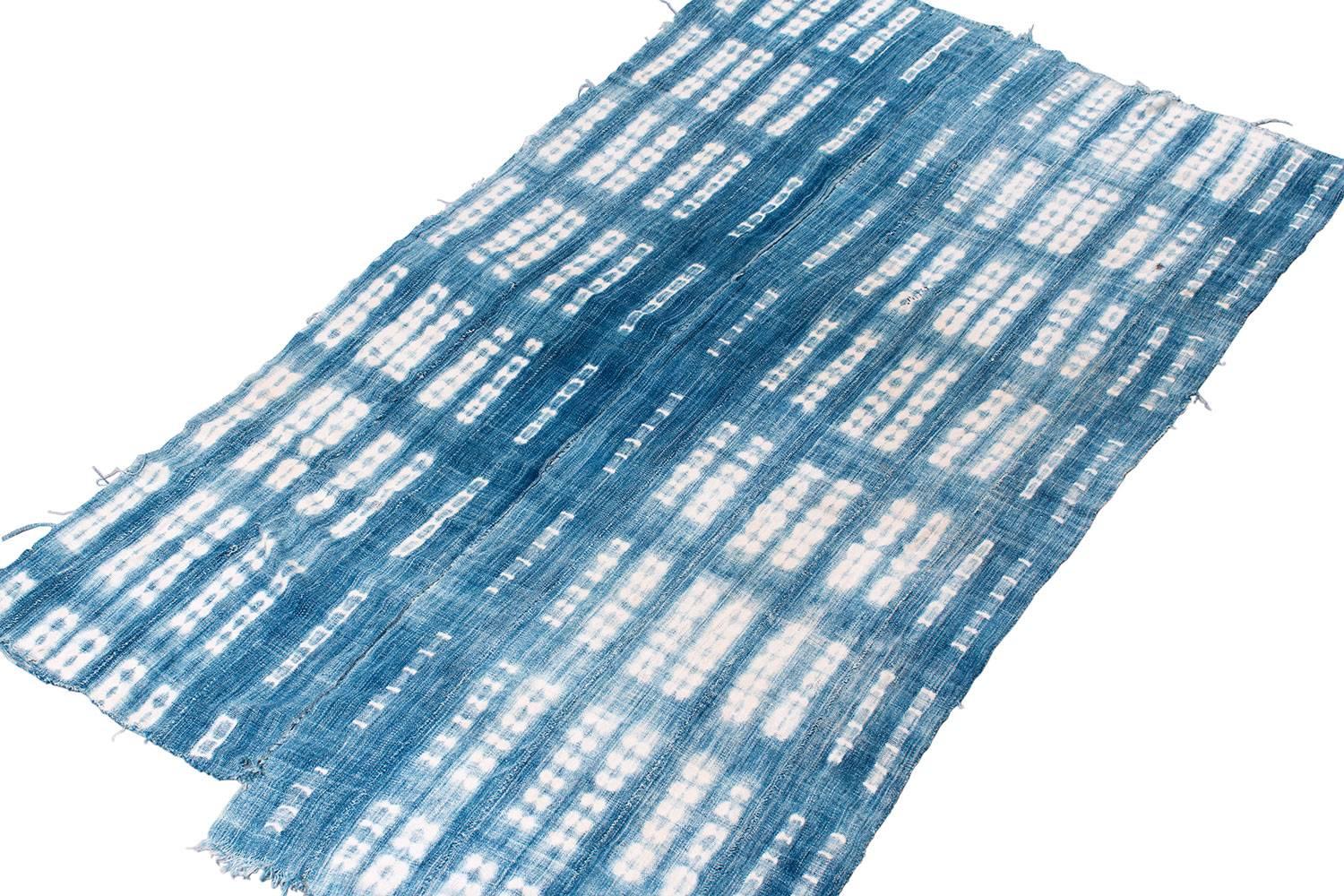 This is a beautiful indigo textile from Burkina Faso in West Africa. This piece has a great denim-like feel and look, the pattern is an indigo dye resist technique. This textile is hand-spun with soft cotton. Such a luminous and beautiful textile!