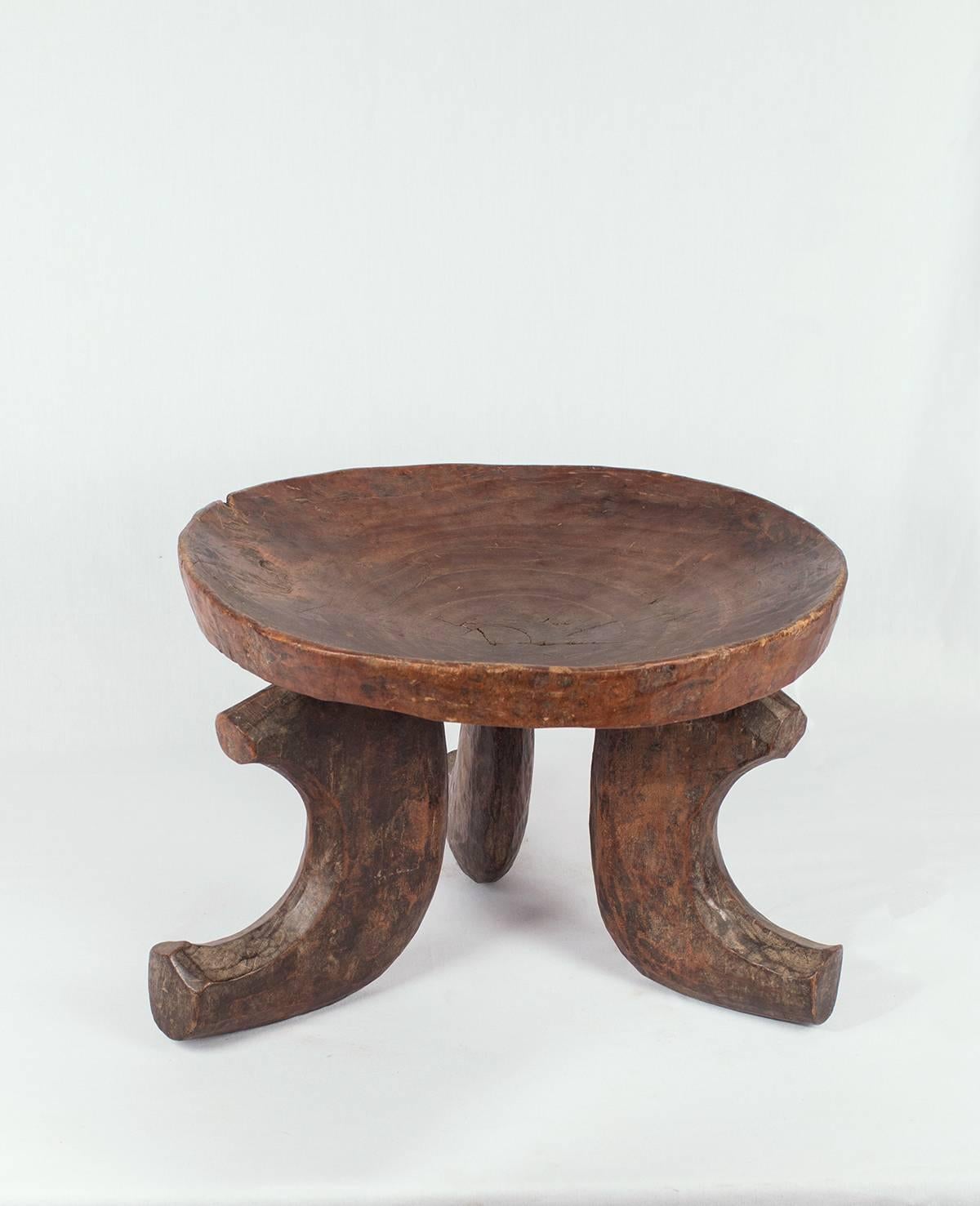 Probably from the Jimma people of Ethiopia, this hand-carved stool is simple but elegant and are noted for their deep, concave surface. They feature a tripod – 3 legged design unique to the Jimma area, a forest area in Westen Ethiopia, Africa. This