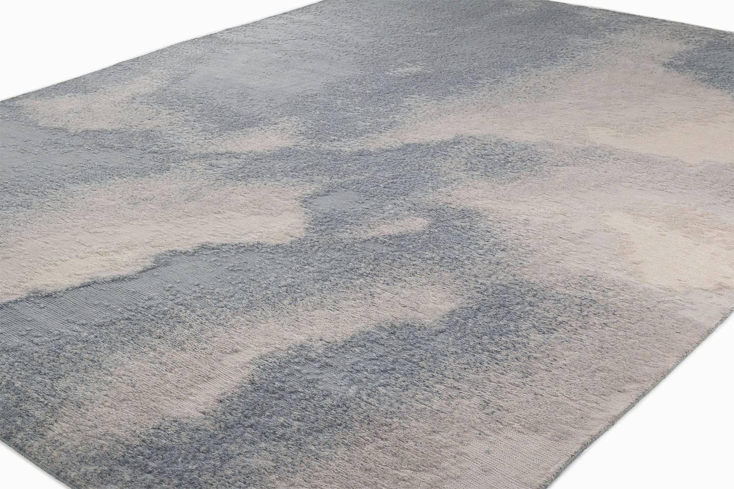 Storm Cloud

Tranquil hues of blue, slate, and grey create the palette of Storm Cloud. Woven in soft silky mohair, this area rug has a luxurious texture due to a unique ancient weaving technique that we have revived. This carpet has an old world