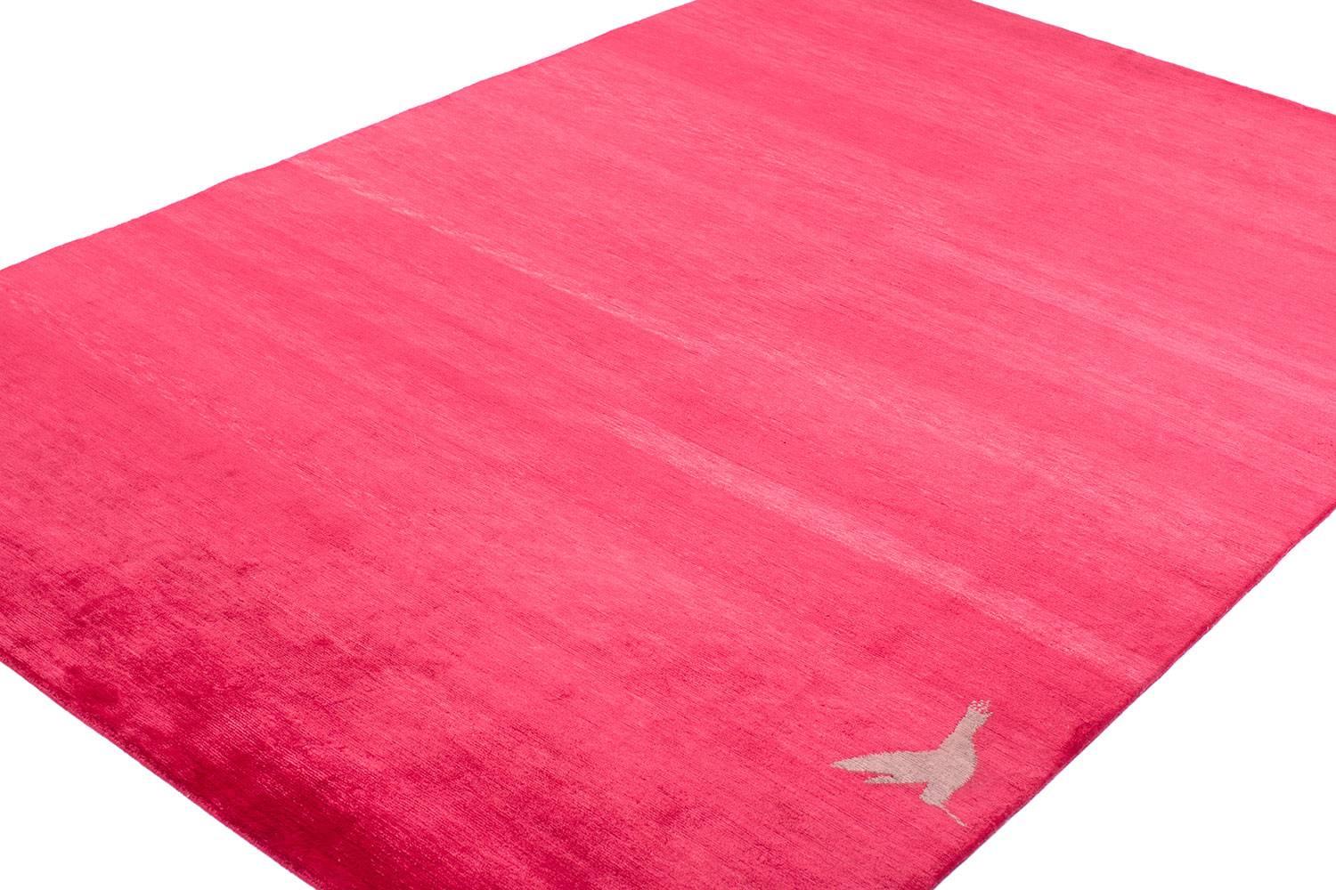 This stunning silk carpet was made with 100% botanical dyes which is remarkable considering the vibrancy of the pink. It measures 6' x 9' and was handwoven in Nepal. Original design by Joseph Carini. The perfect accent to a girls bedroom! 

 