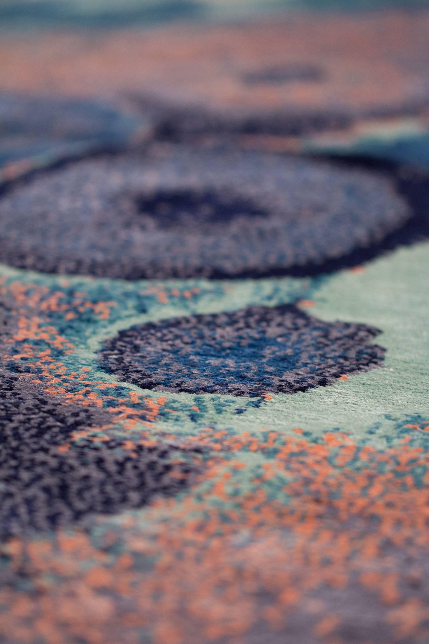 Psychedelic tones of purple, candy floss pink, and ice create the captivating balance of light and dark in Ocean Jasper. Depth and space collide in the artful complexity of this modern design by Joseph Carini carpets. Custom colorway by Andreea