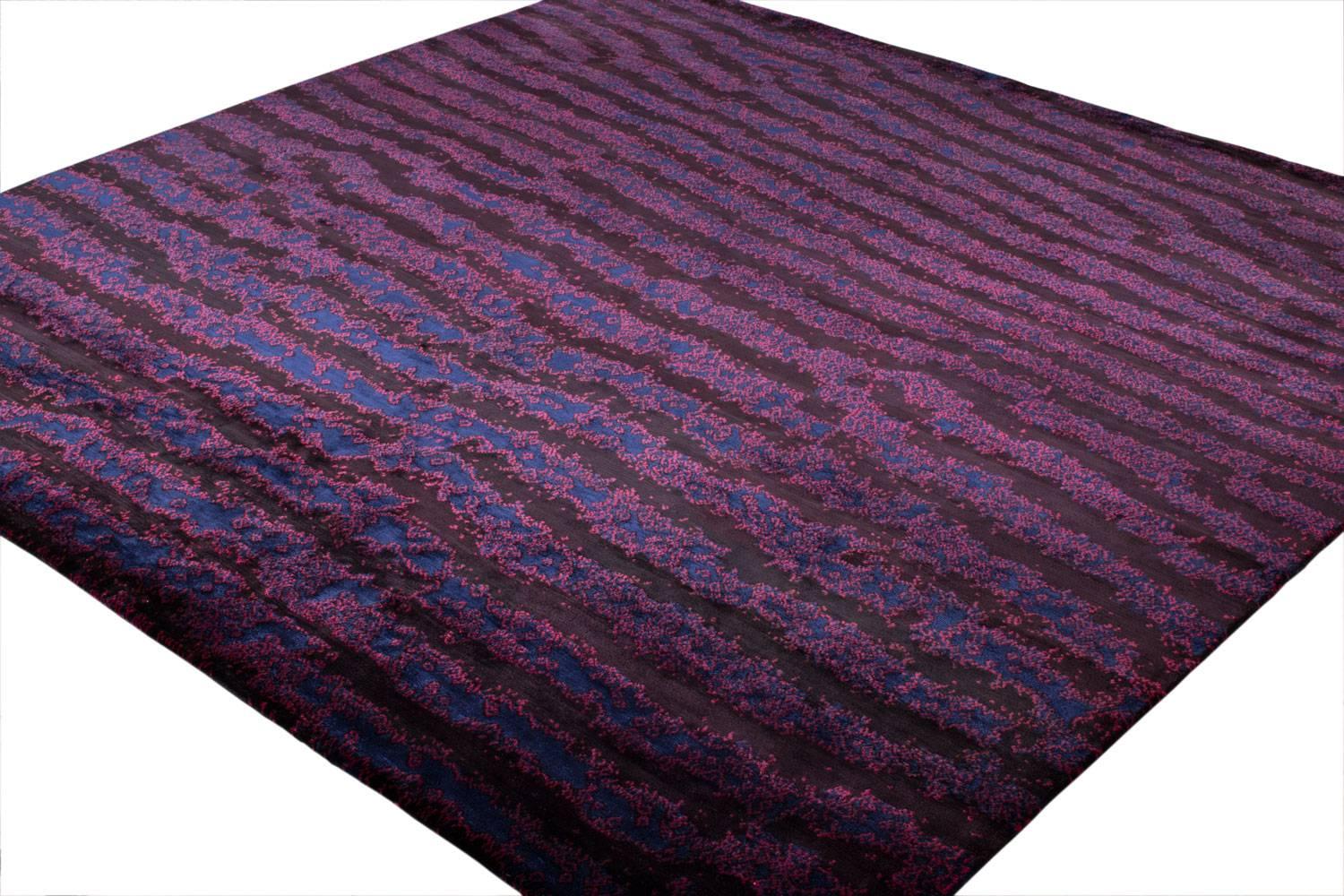 Deep purple solid silk carpet, hand dyed with vegetable dye and handwoven. Wavy stripes of color alternate with bands of froth in the tranquil pattern of Fishskin. It loosely resembles the camouflage of tropical creatures and repetitive waves