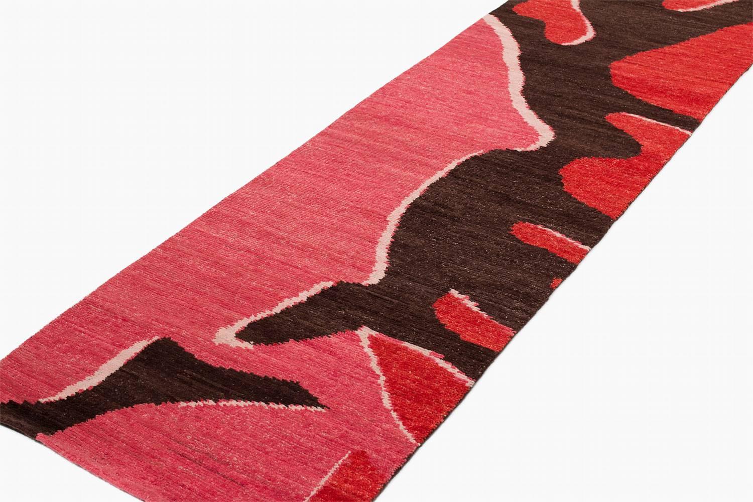 Bold and daring this handmade runner rug has bright pinks, deep browns and red accents - The design, which is reminiscent of Camo patterns was inspired by abstract forms in nature meets Pop Art!

All designs offered in custom sizes, colors, and