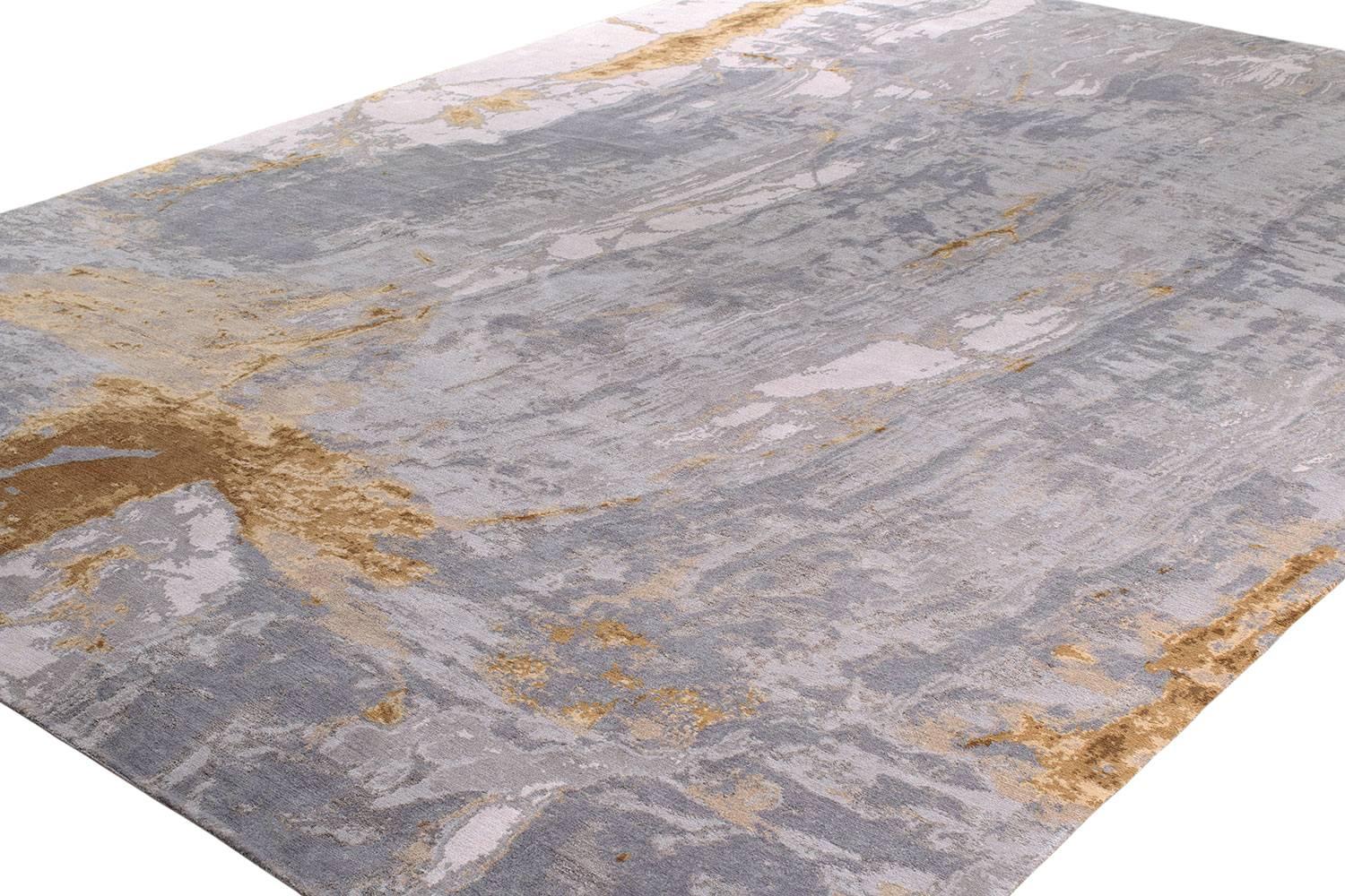 Taking inspiration from slabs of stone, the design focus quickly turned to the color. Dakota has an organic movement throughout, the use of cool colors with hints of gold accents pulls that movement out. The subtle colors uncover themselves over