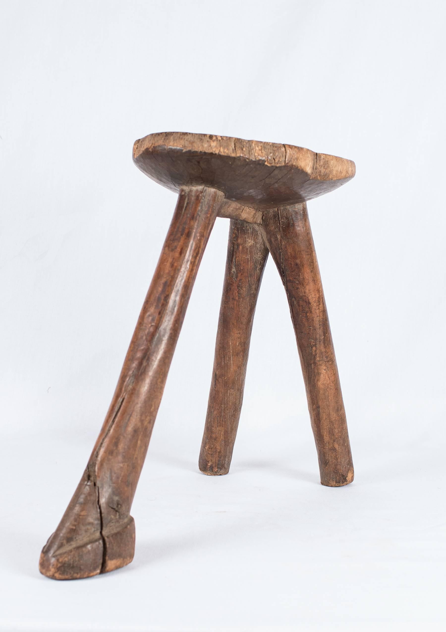 This African Lobi stool was created by the Lobi People of Ghana. It was carved from single blocks of wood, and has a wonderfully simple form. It has aged beautifully by use and exposure. This seat is surprisingly comfortable and well-balanced. We