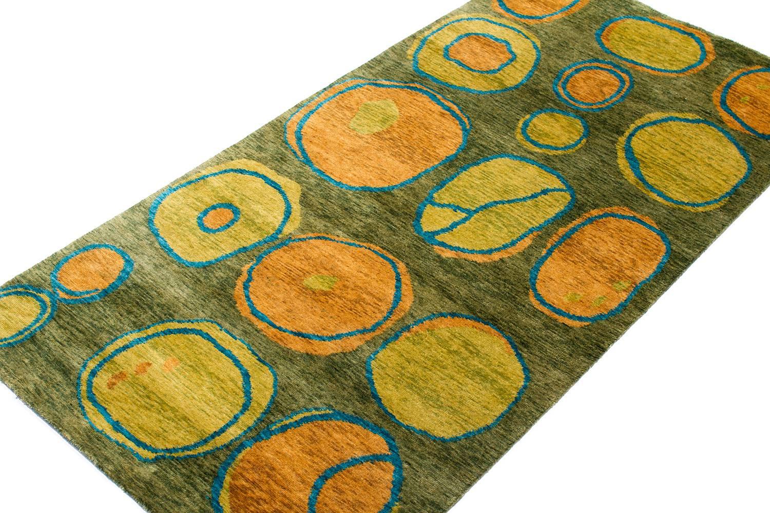 This grassy green carpet is an original design by Joseph Carini titled 'Otto'. Hand-knotted in Nepal in matka silk - matka silk is coarser than regular silk, it vaguely resembles linen, it is a simple and elegant material which is often used for