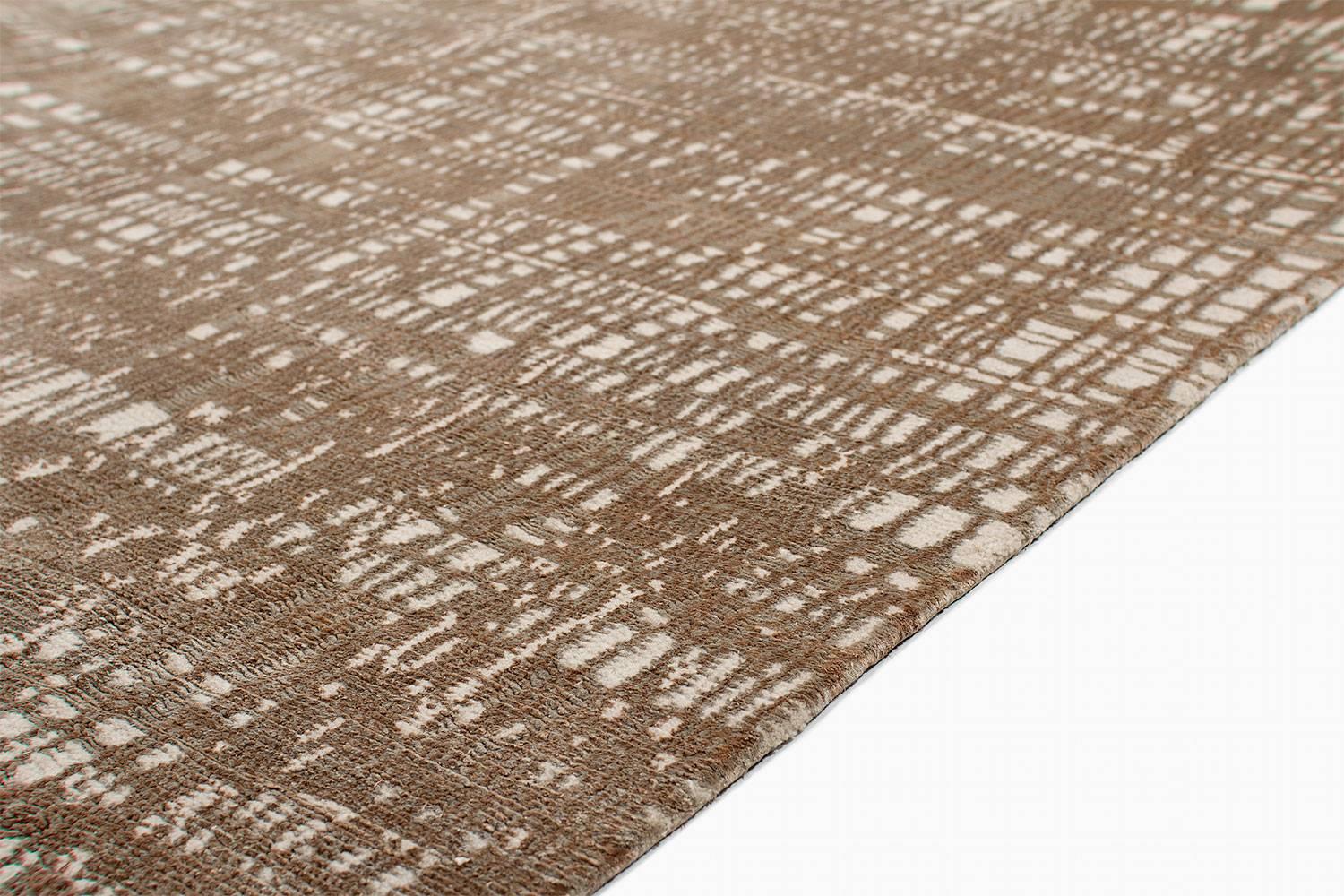 Scratchout is an original design from Joseph Carini's couture collection. This area rug is made with silk and wool and has an incredible shimmering surface. The pile is sumptuous. A classic contemporary rug.