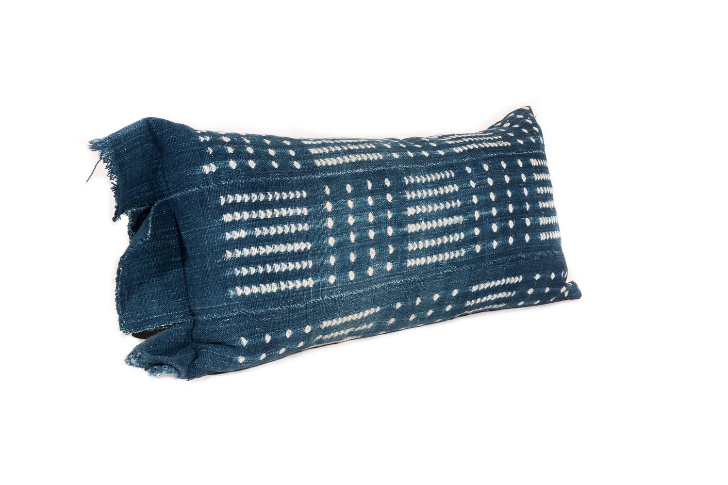 Made from Indigo tie-dyed African textiles and stuffed with a nice blend of down and goose feather. The textile has been backed and is beautifully crafted with a zipper for easy removal.