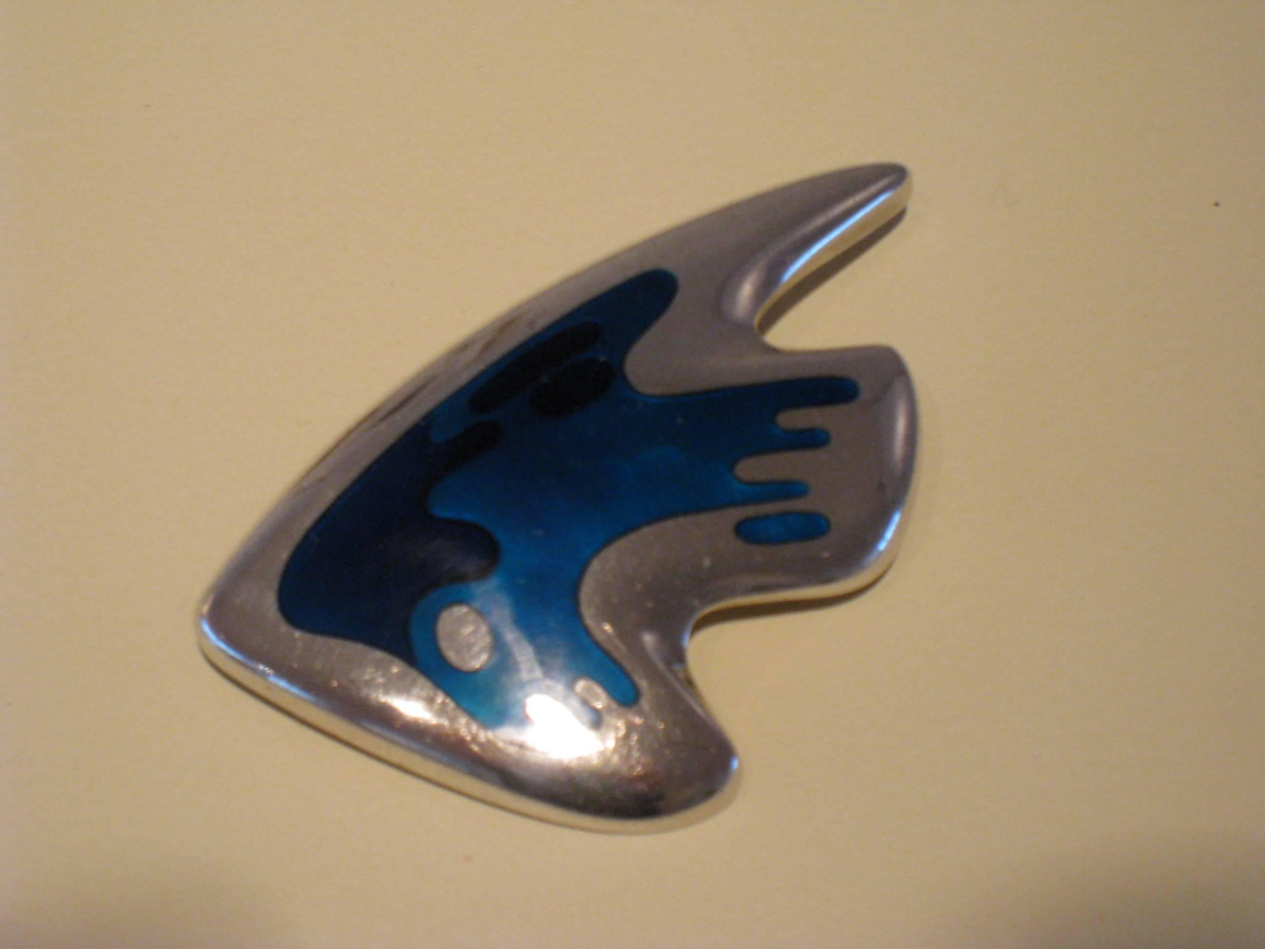 For Georg Jensen, late 1940s-early 1950s
sterling silver, with shaded blue enamel 
Stamped marks and '307'.