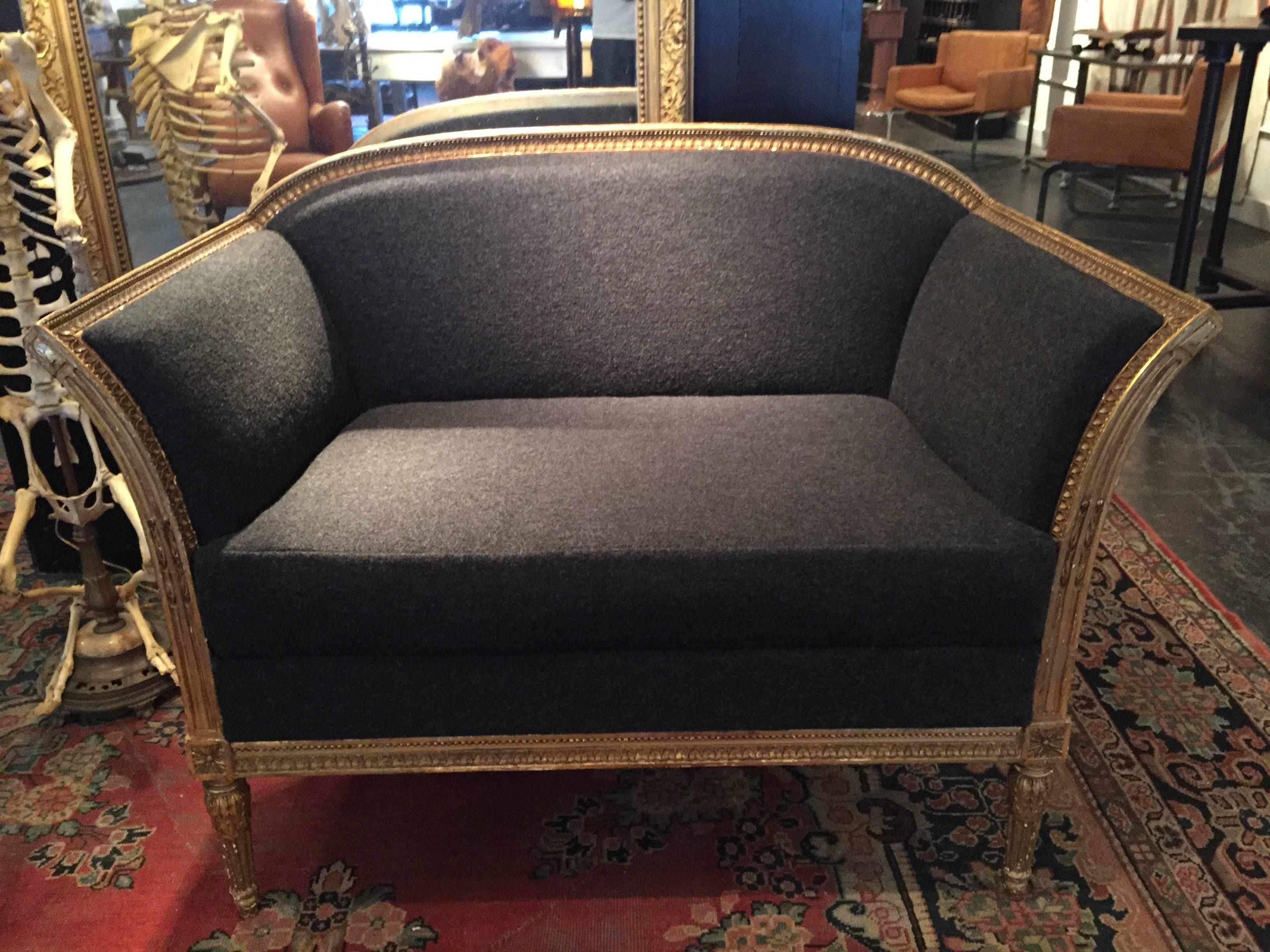 19th century French gilded settee fully restored and upholstered in Holland and Sherry boiled wool.