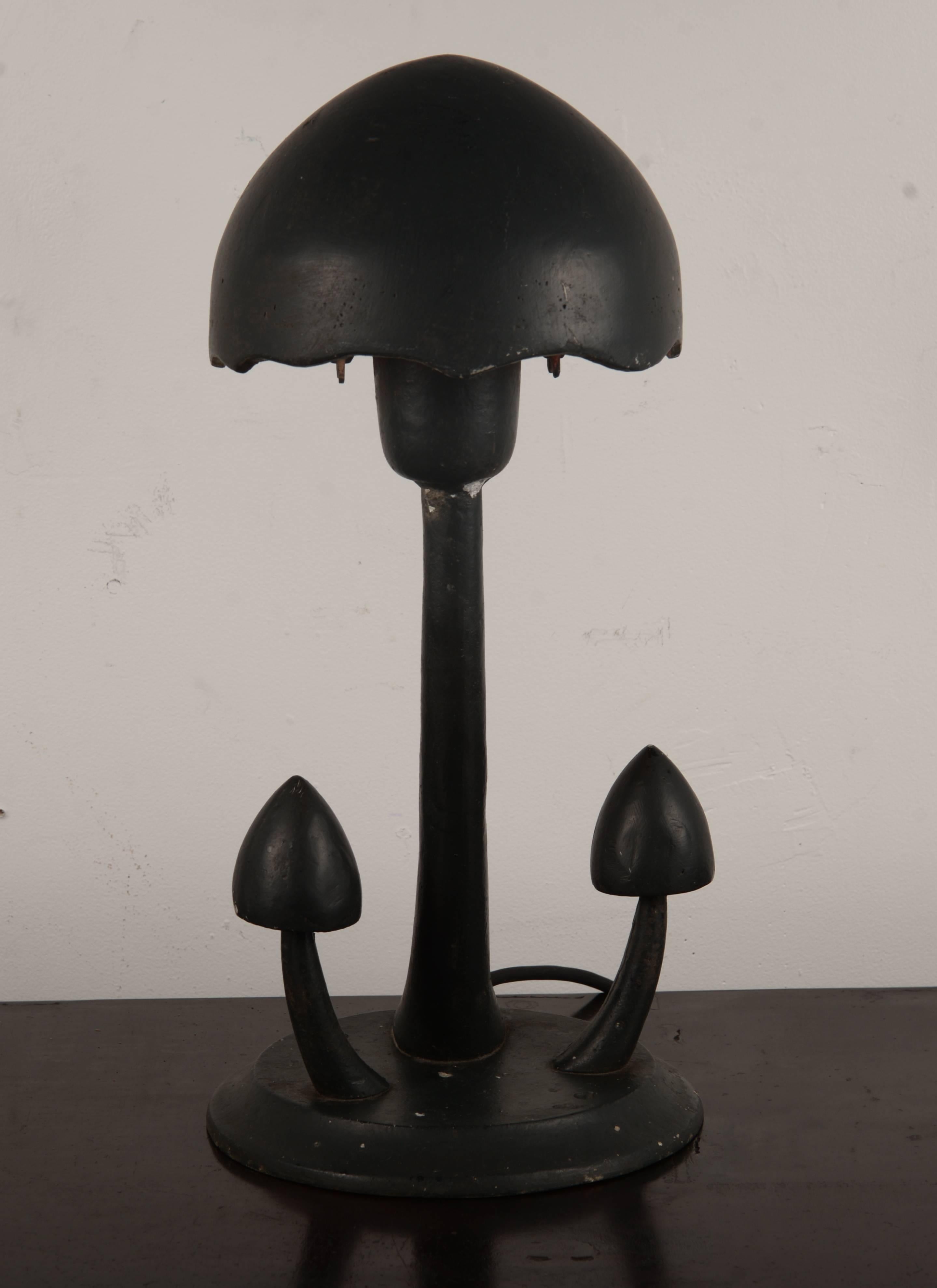 Black painted cast aluminum mushroom lamp. These were originally designed to be outdoor lighting.