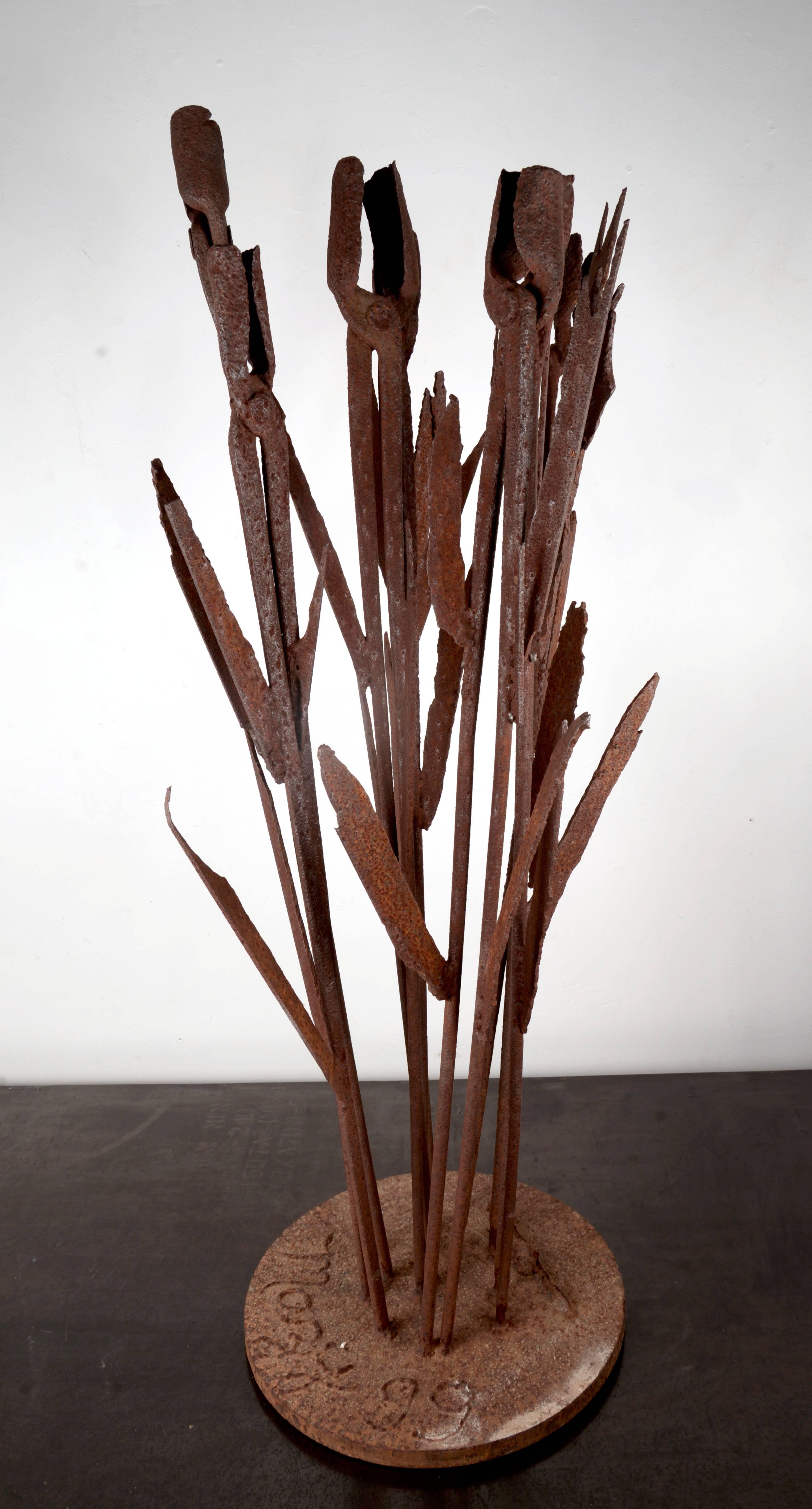 Tall signed steel sculpture constructed from steel plate and vintage forging tools.