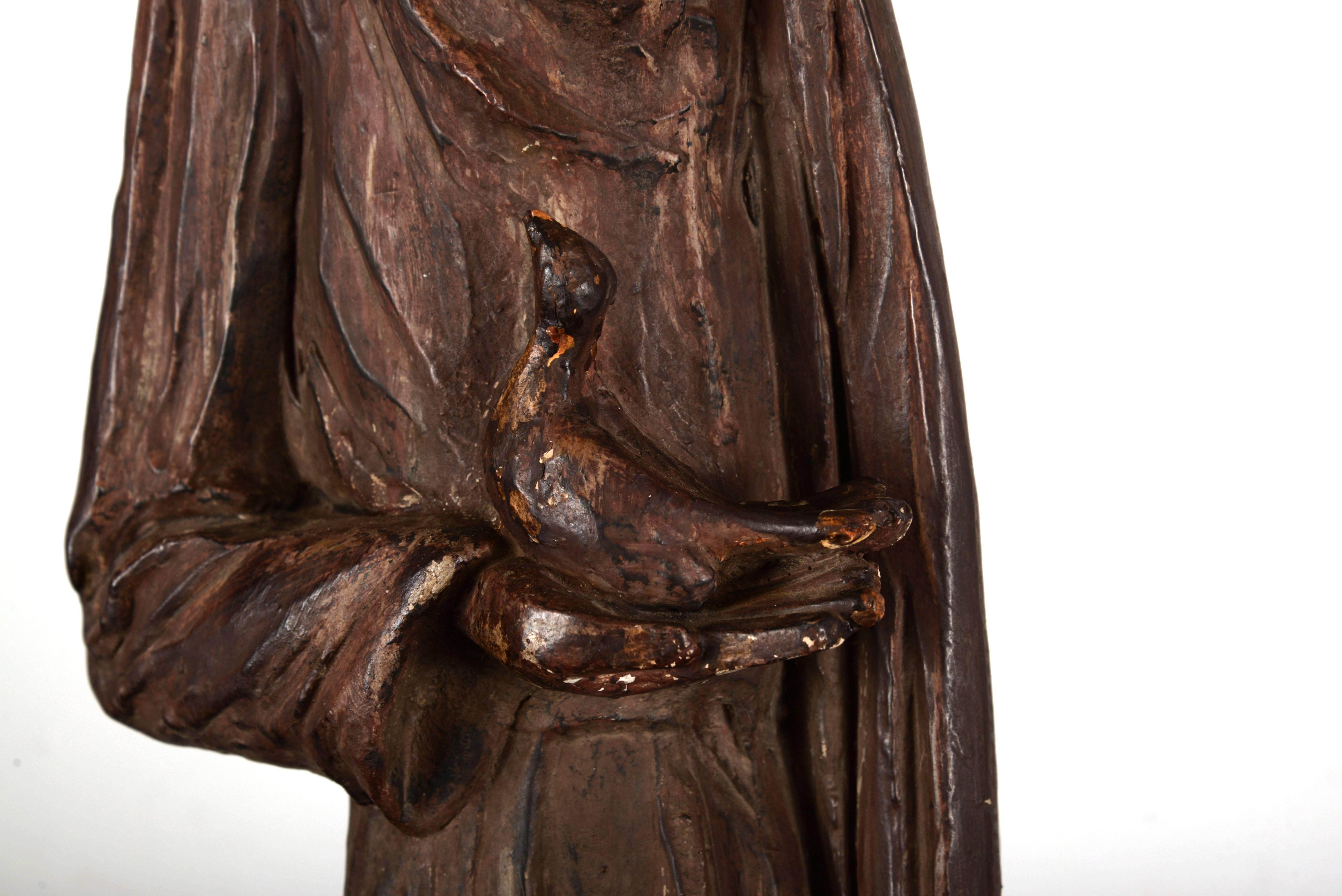 Cast resin Saint Francis sculpture.
