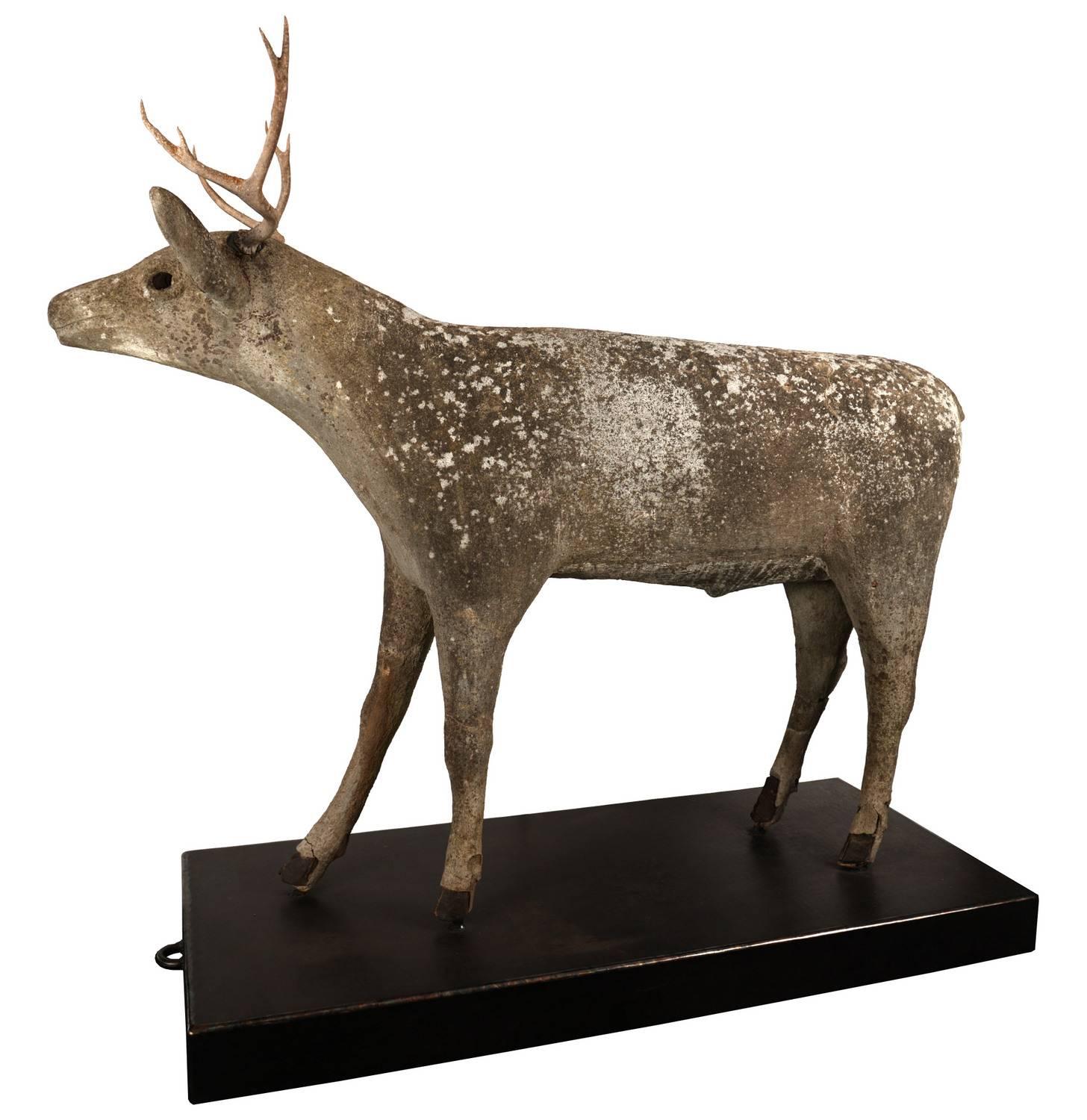 This naive Folk Art beauty is larger than lifesize and has been hand-formed out of concrete and steel. Organic elements include a real deer skull and hooves. The steel armature has been welded to a custom-made steel plate on rubberized casters