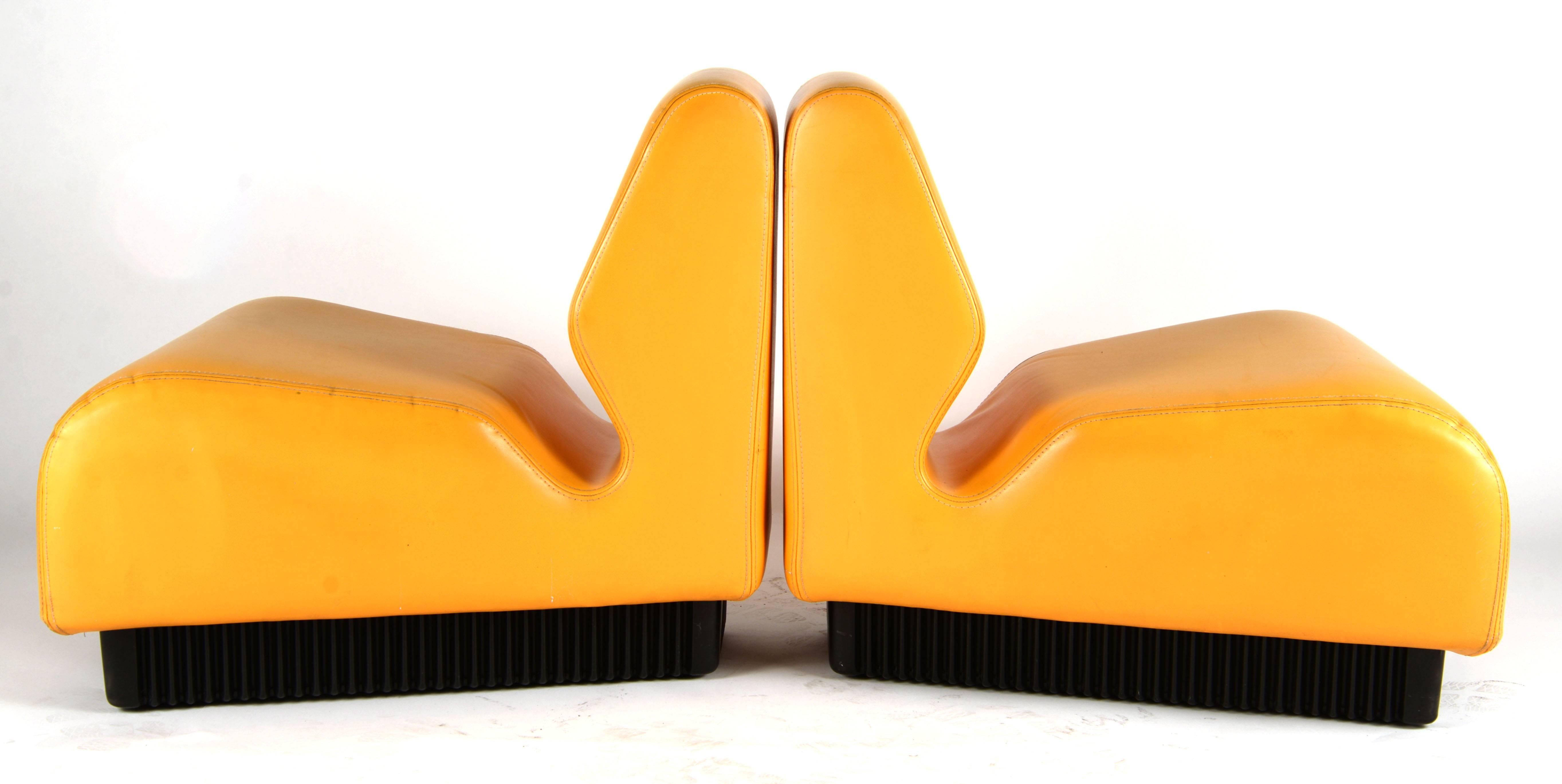 Pair of modular yellow double stitched airport lounge chairs design by Herman Miller in the 1970s.
  