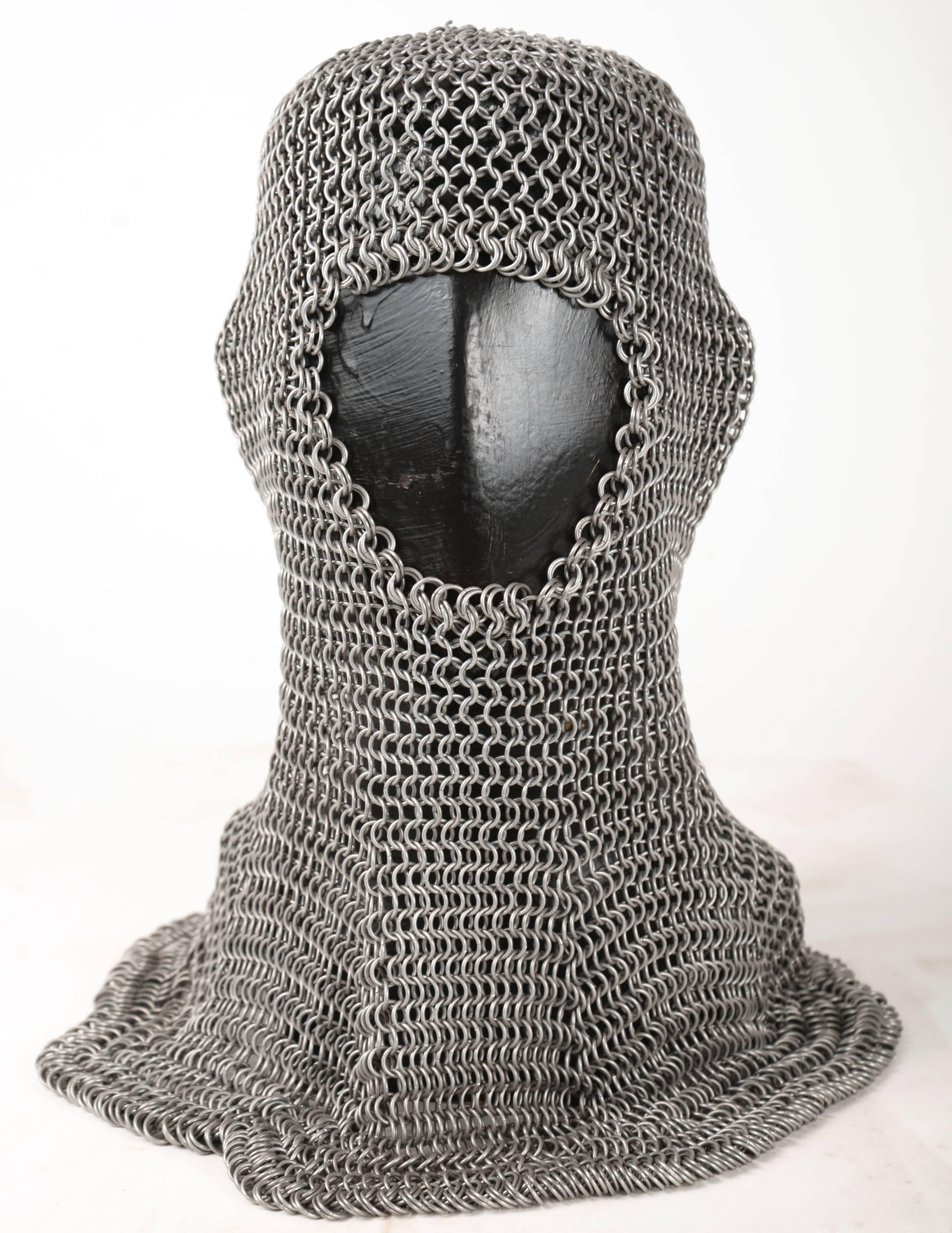 Handmade aluminum chainmail hood. I believe this was a student project in spite of its beautiful construction and detailing. Included is the black painted 1930s mannequin on which it's shown.