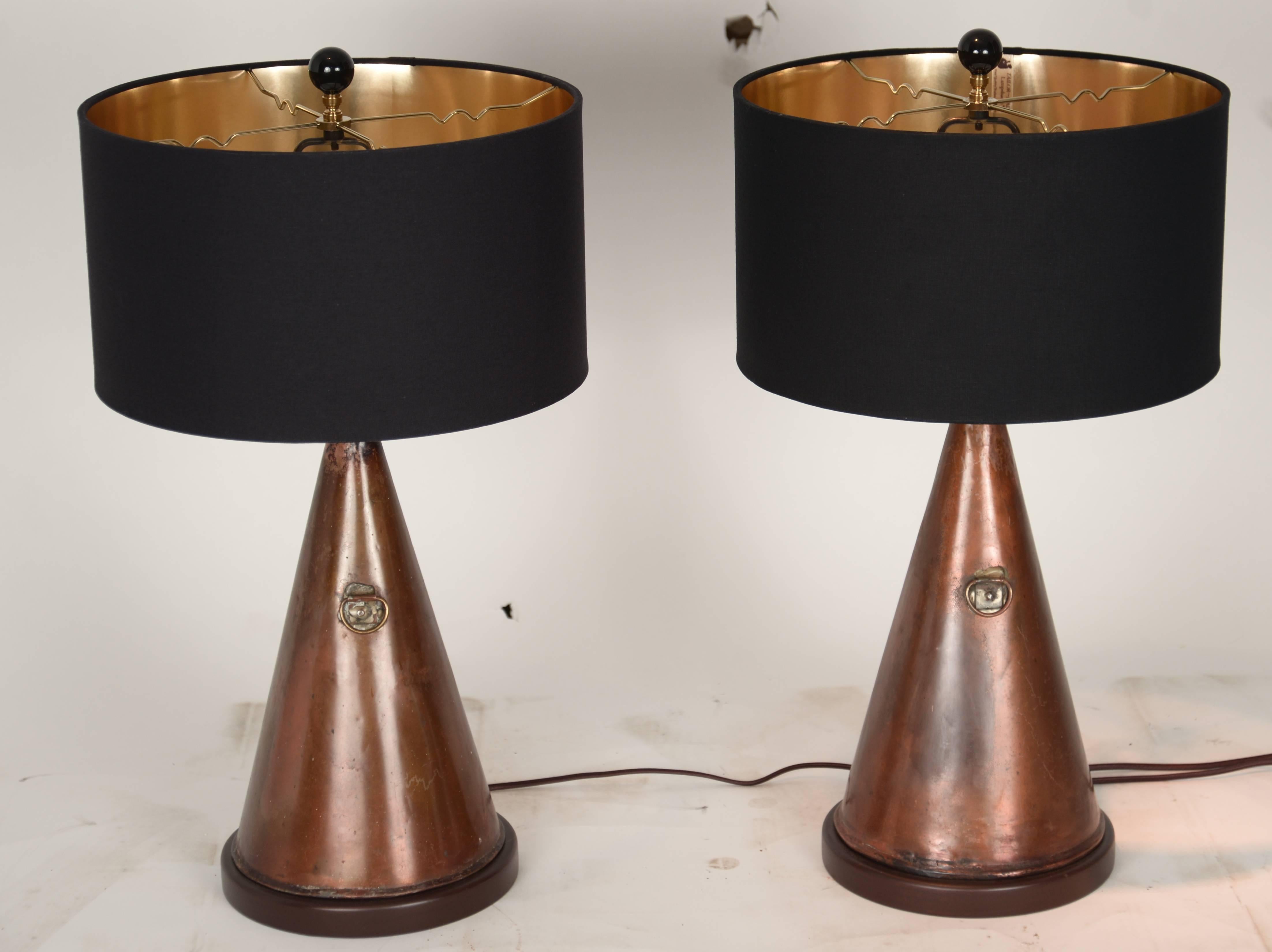Pair of custom-made table lamps made out of antique ship foghorns with new gold lined black lampshades.
