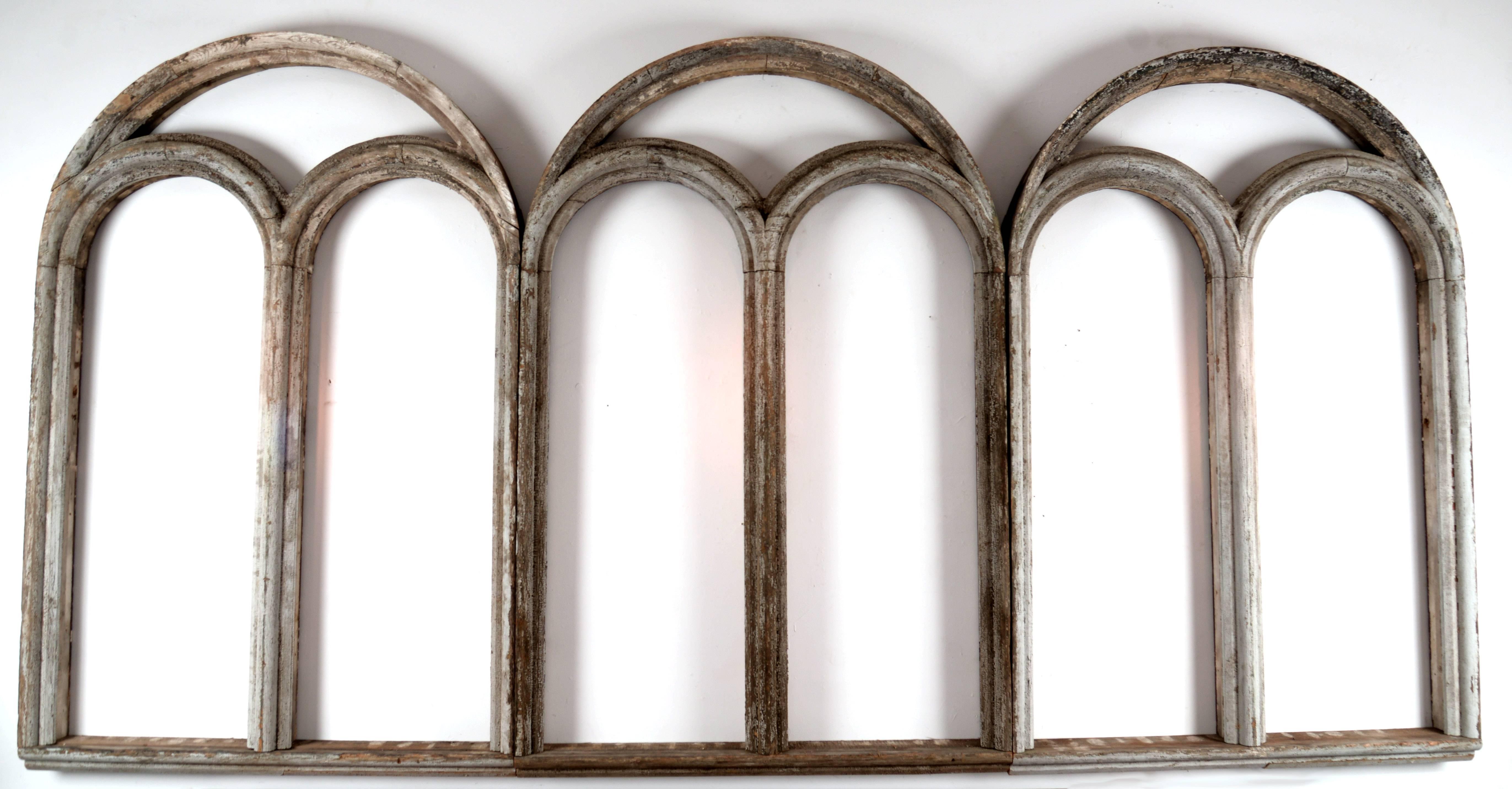Collection of three double arched wooden windows out of a cathedral in upstate New York.