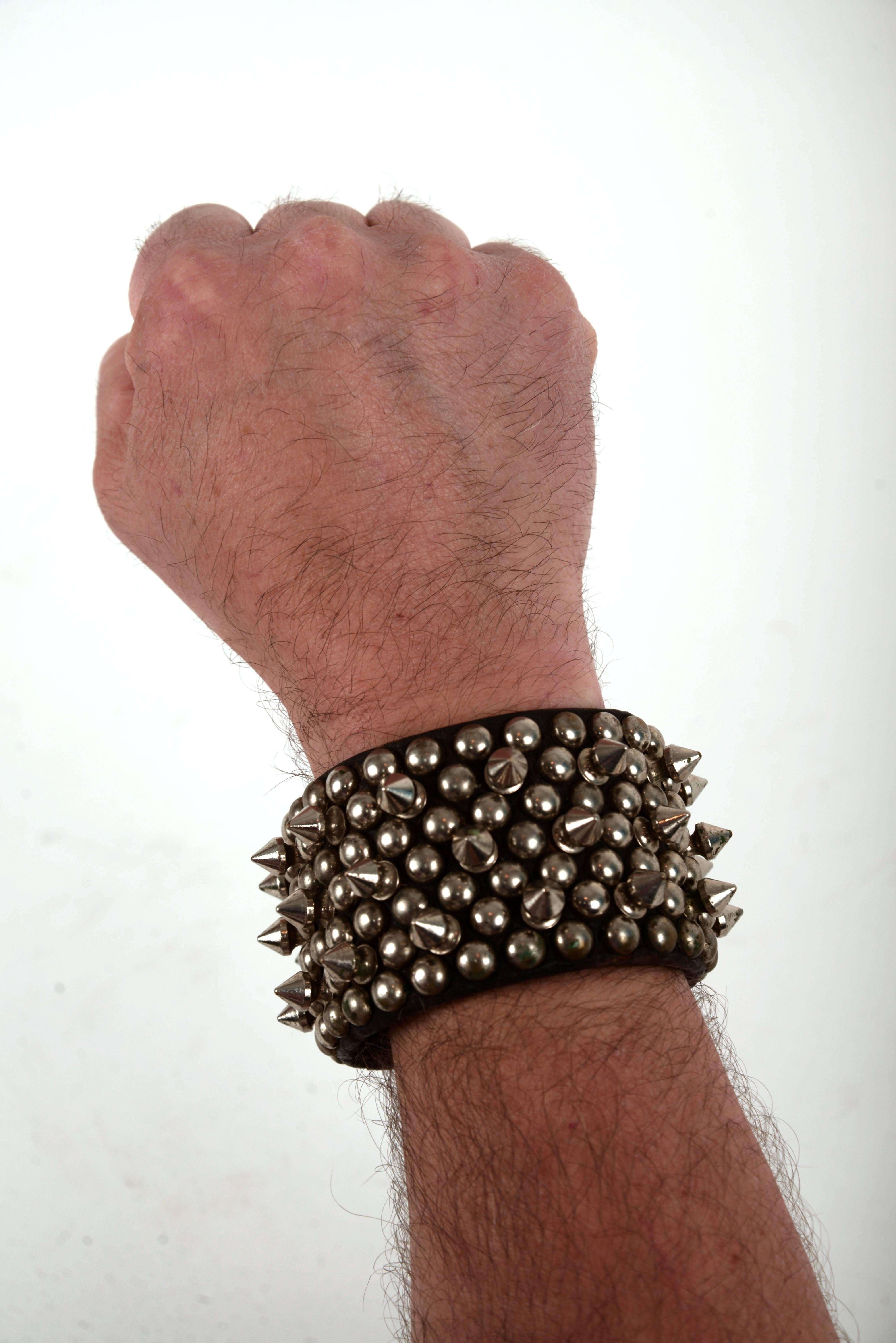 Collection of four handcrafted leather spike/studded accessories for the neck and wrist.