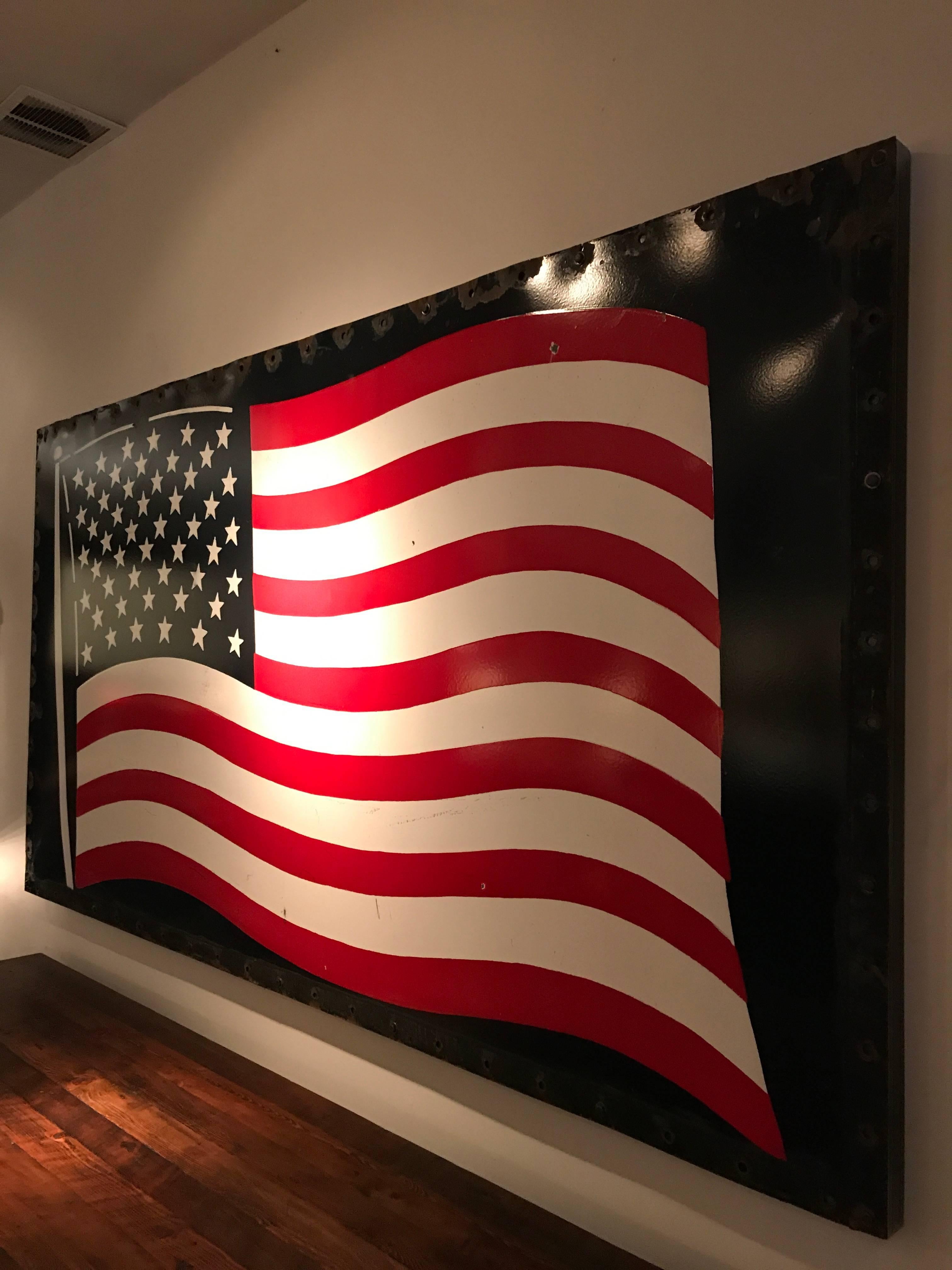 Large-scale enamel on steel American flag mounted onto a steel frame with a built in French cleat.
