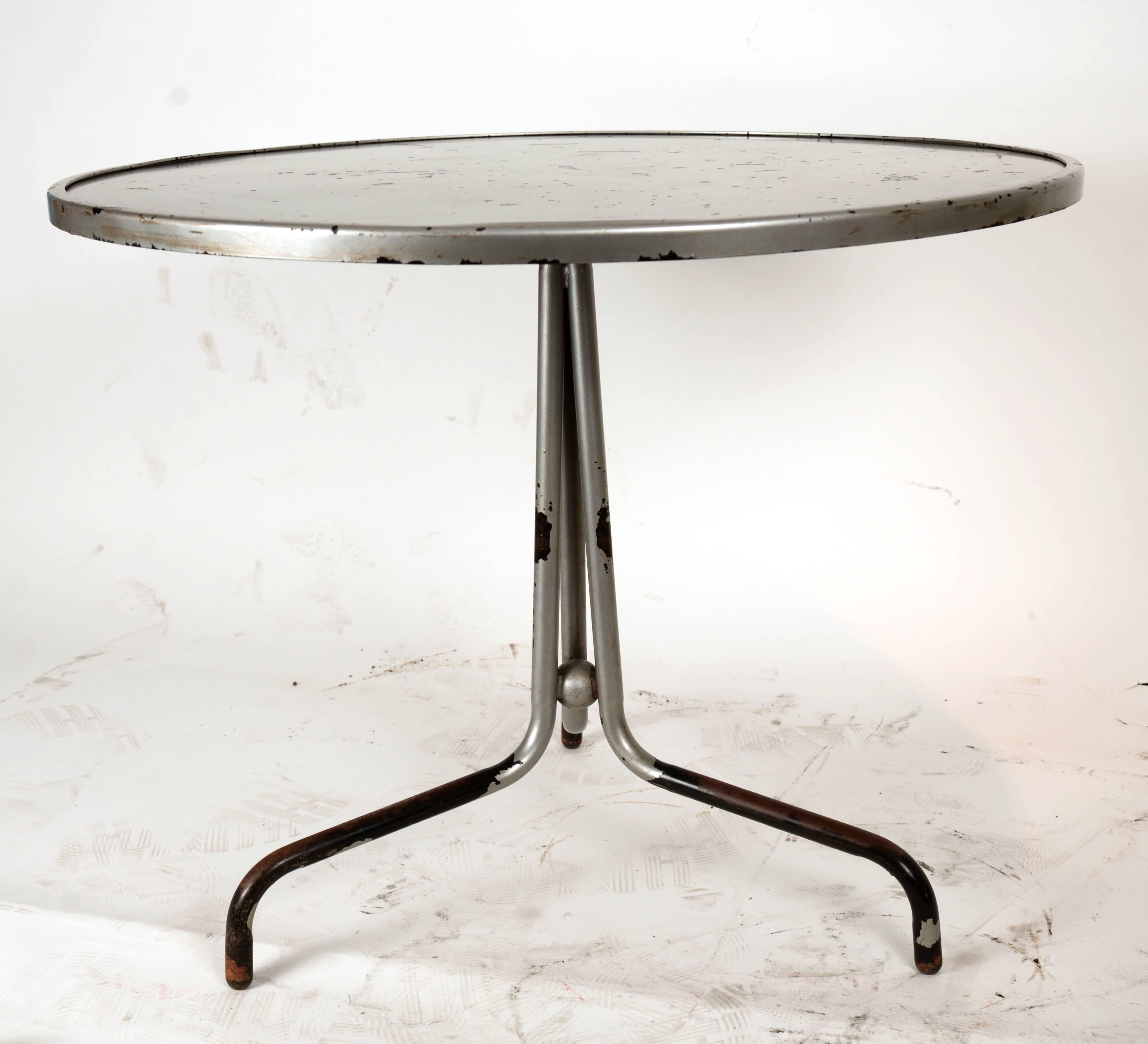 Steel round French side table with distressed silver over-paint.