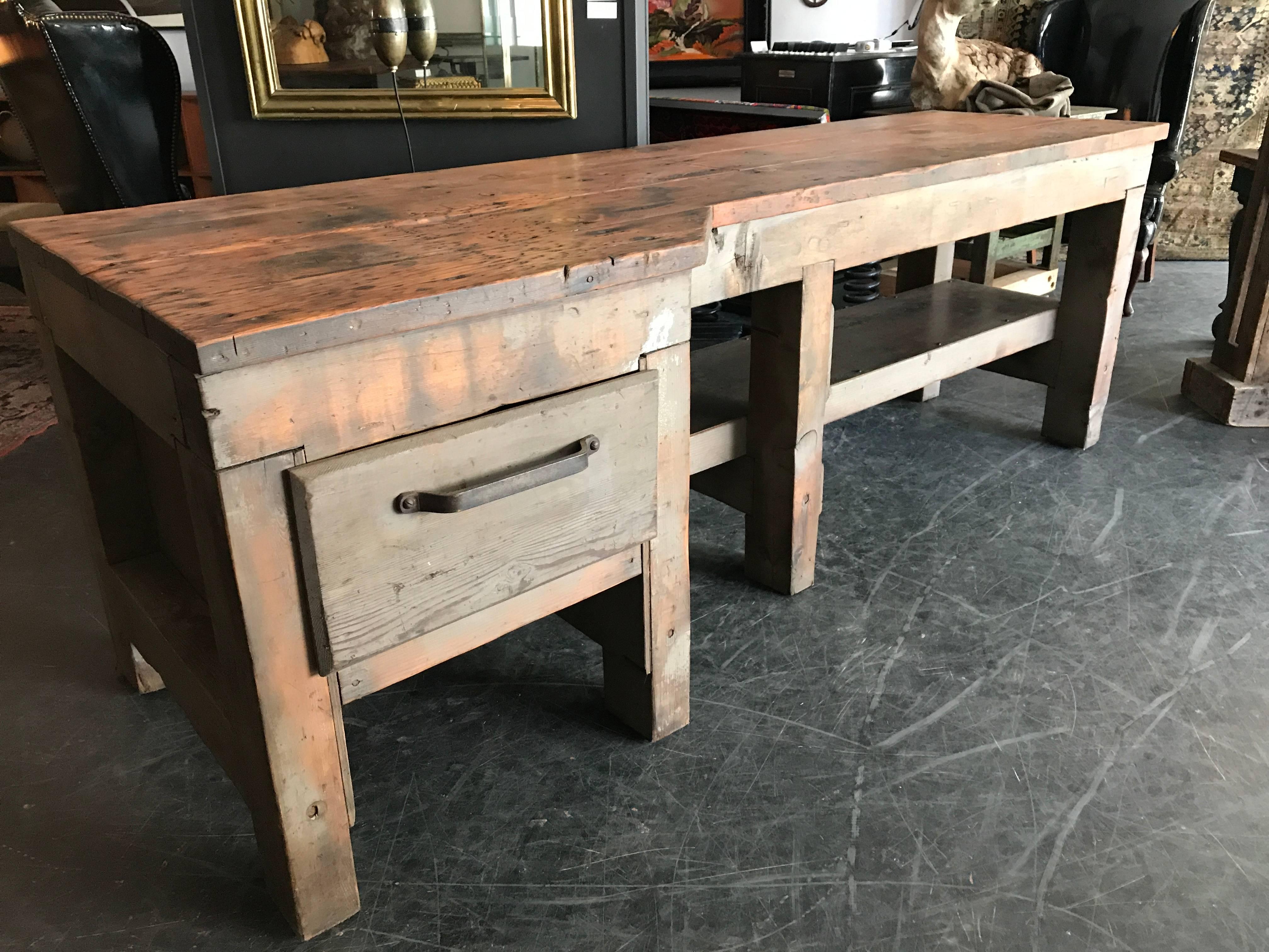 Beautifully restored Douglas Fir work station with remnants of pale grey paint. The lower shelf area has been finished with vintage steel plate and the single deep drawer has a beautifully forged original forged handle. This piece is super clean and