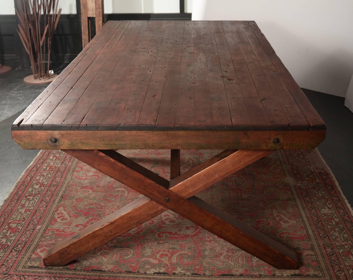 Simple clean lines define this Classic heavy duty Douglas fir early century dining hall table. The X brace leg design allows for excellent chair clearance while maintaining excellent stability.