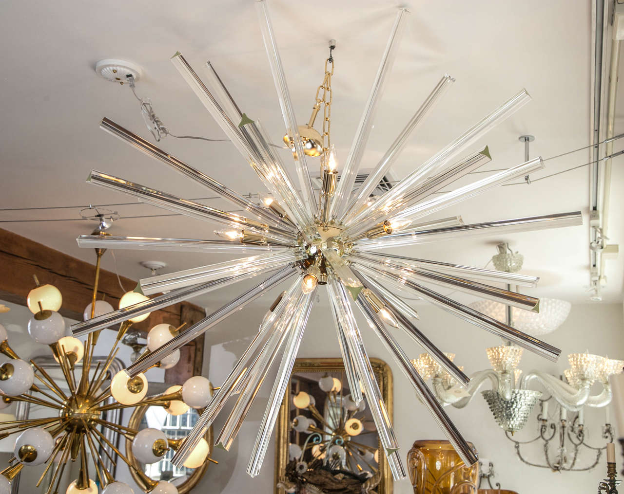 Starburst Sputnik ceiling fixture comprised of blown triedri crystal glass rods in two lengths, hardware available in brass, chrome and champagne matte brass color. Measuring 44