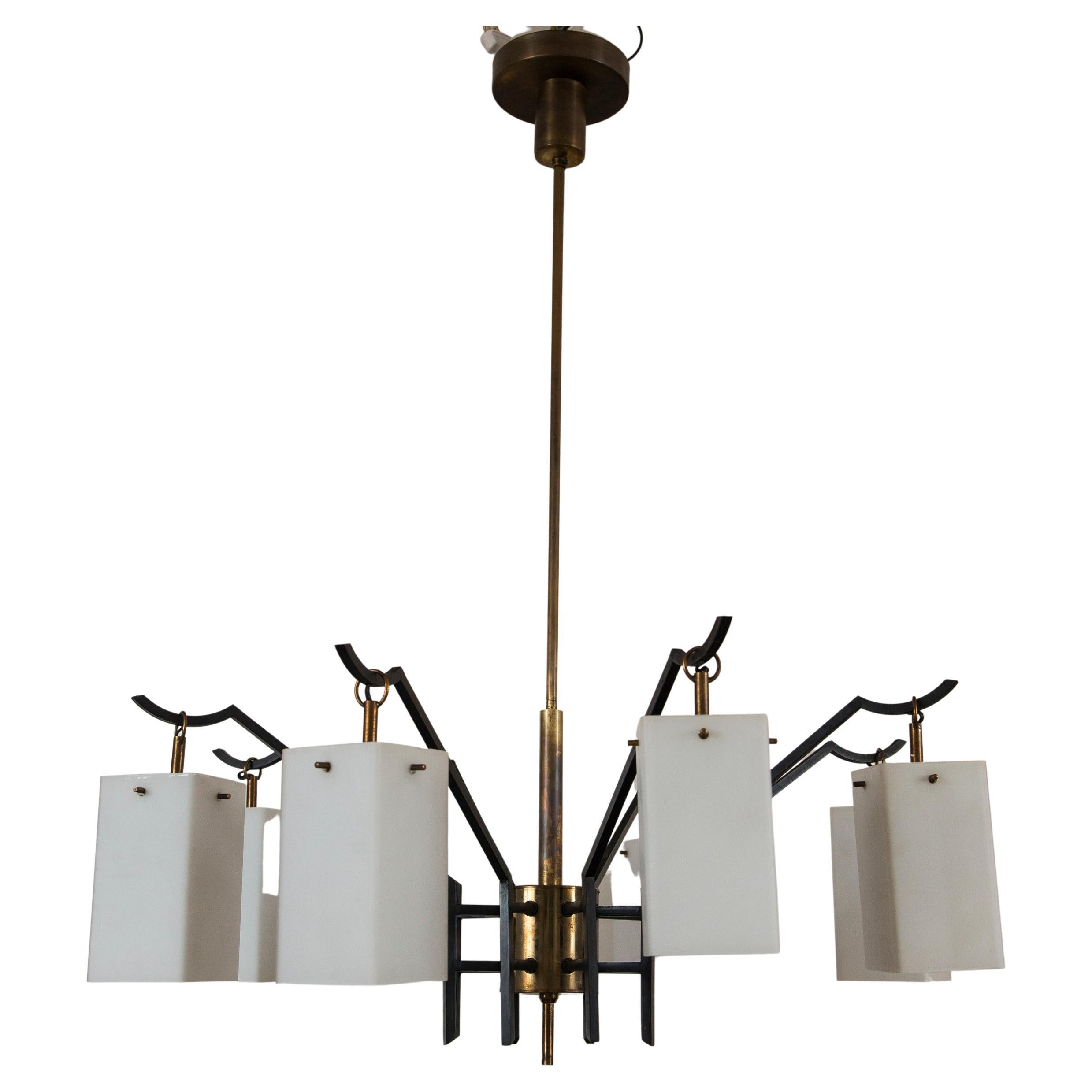 Elegant mid century Italian solid brass chandelier with six angular outstretching arms holding rectangular shaped satin opaque white glass shades attributed to Stilnovo, illumination is beautiful, re-electrified to code with new brass candelabra