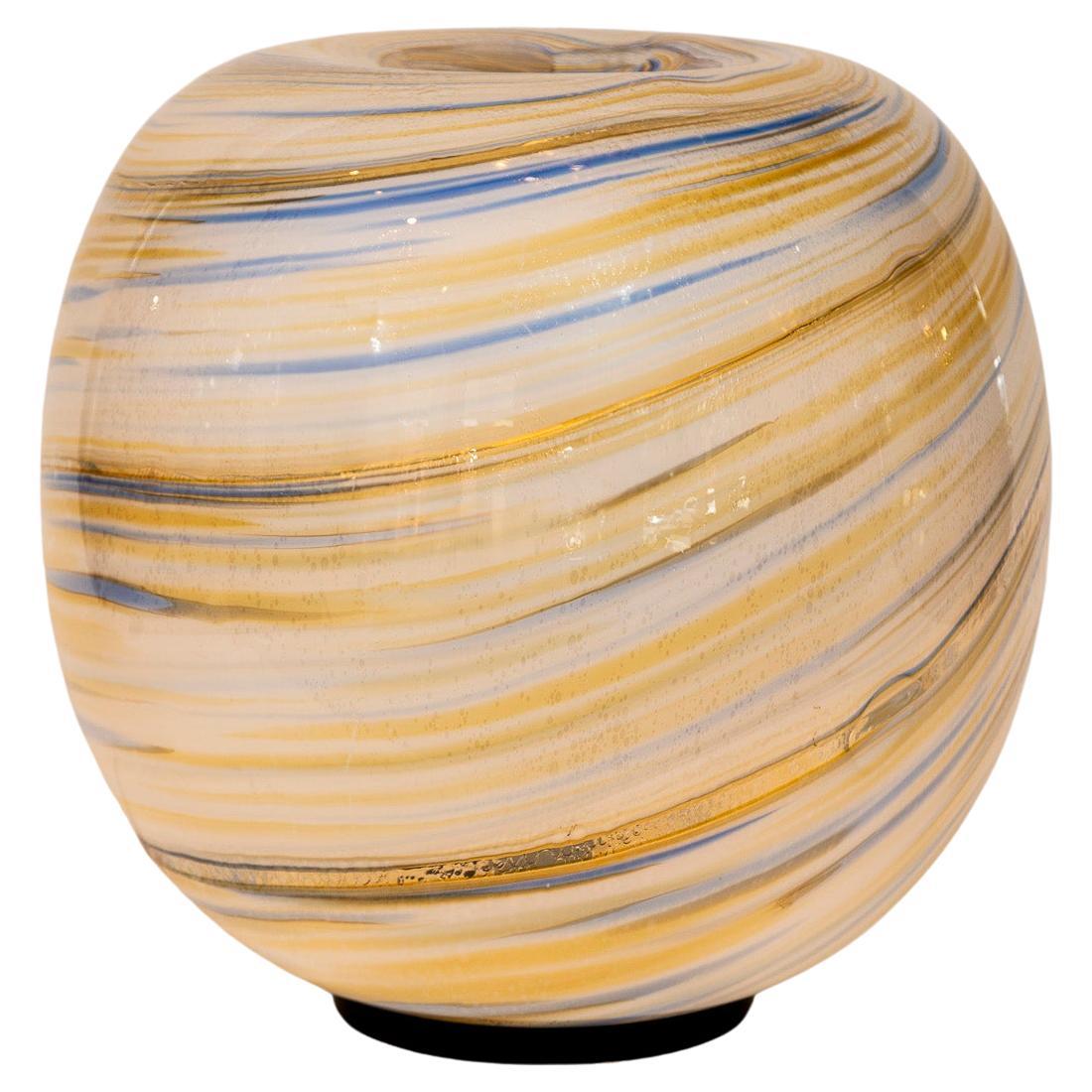 Lovely large orb -shaped table lamp blown in white, pale blue and golden ochre swirls.

Re-electrified to US code with one porcelain E26 socket with a dimmer on cord, LED dimmable bulbs up to 100 equivalent watts

Origin: Murano, Italy

Dating: