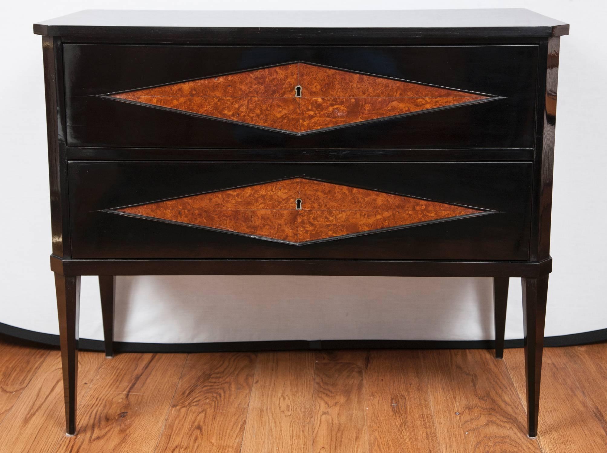 Stunning pair of Continental decorative vintage two drawer chests with inlaid burl wood diamond shaped front panels finishing on high tapered and angular legs, shown in a hand lacquered polish, working keys provided for each drawer.
In excellent