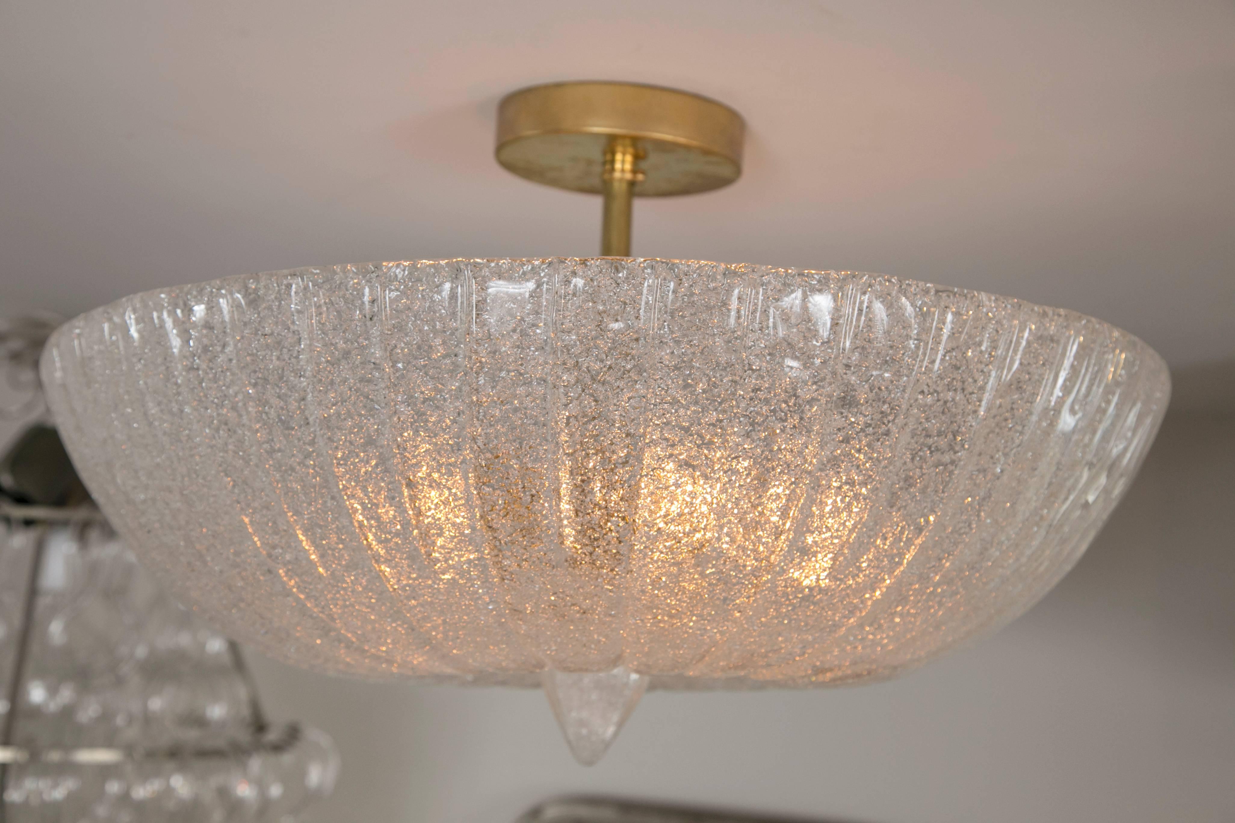 Elegant frosted icy  Murano glass blown ceiling fixture with matching glass finial

This fixture will be made install ready with unlacquered brass hardware to match the brass detail on the finial and electrified to code once purchased. Please