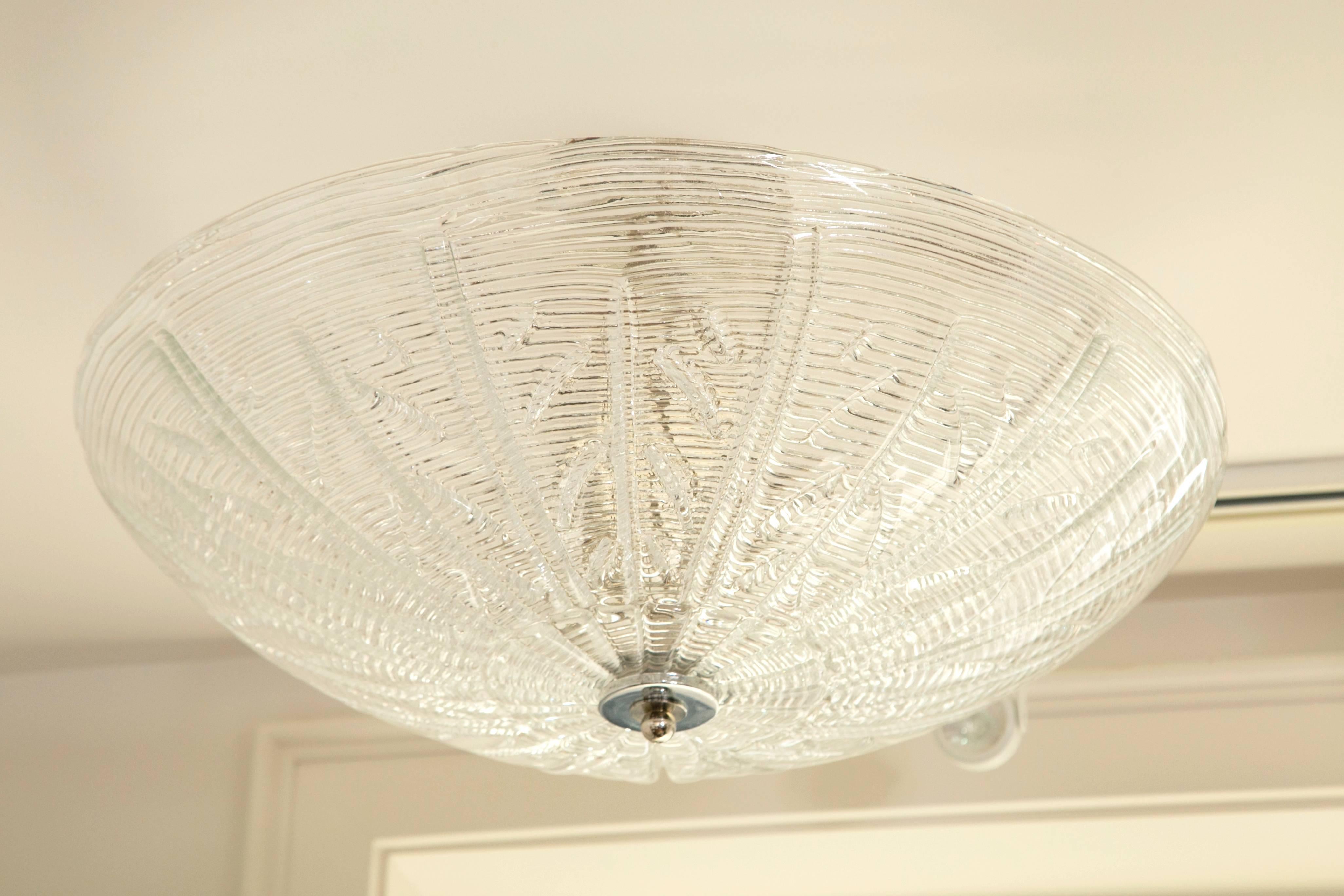 Striking Murano blown ceiling fixture shown with a ribbed and a stylized leaf pattern.
Made install ready in nickel or brass fittings for near flush, semi flush or pendant lighting- overall drop is custom fitted to your desired drop
Note -while this