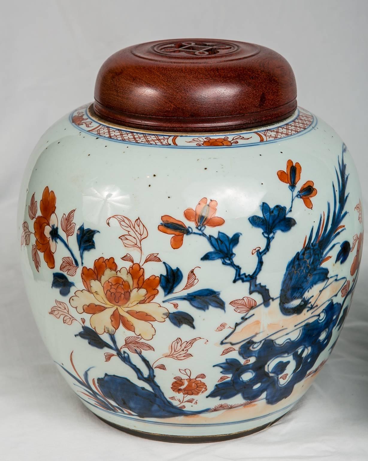 Provenance: with the label of Elinor Gordon.
Chinese Imari ginger jars made in the mid 18th century circa 1760 
(Dauguong  (1820-1850). Each jar is painted in cobalt blue and orange showing a butterfly and a long tailed bird on a rocky outcropping.