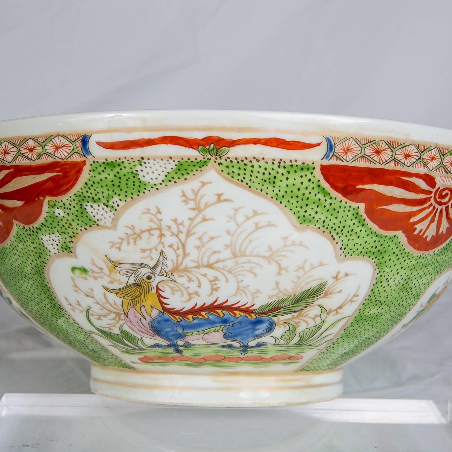 Antique  porcelain punch bowl painted in the Bengal Tiger pattern also known as the "Dragon in Compartments " pattern. The exterior of this exceptional bowl features four panels alternating between dragons and the objects of good fortune