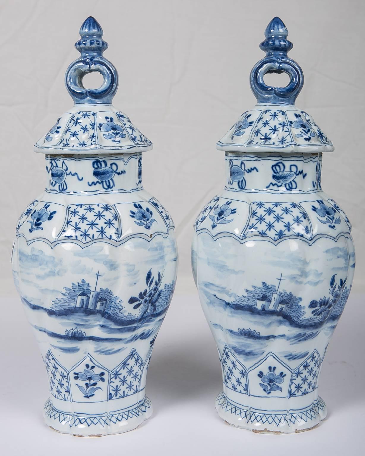 An attractive pair of blue and white Dutch delft covered vases painted in the softest pale blue. What make these vases special is the size (12