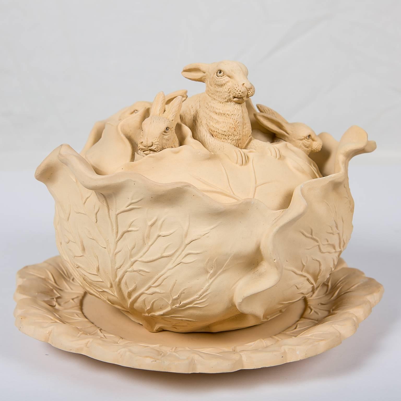 We are pleased to offer this stoneware game pie dish decorated with four rabbits peeking out over the top of a cabbage. The game pie dish was made by William Schiller and Sons circa 1880.
This type of stoneware is known as caneware. Caneware is an