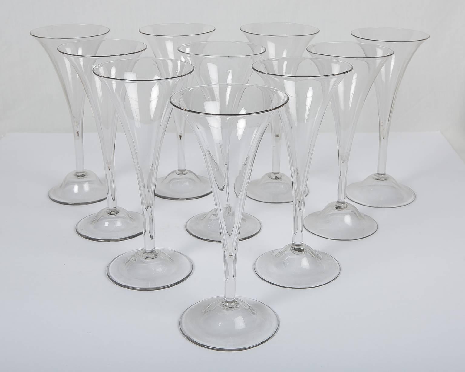 Cheers to welcoming friends!
This is a beautiful set of ten clear large (8.5inches tall) English mid-18th century clear champagne flutes (even though in the main image the glass does not appear clear, that is due to the photoshopping. The glasses
