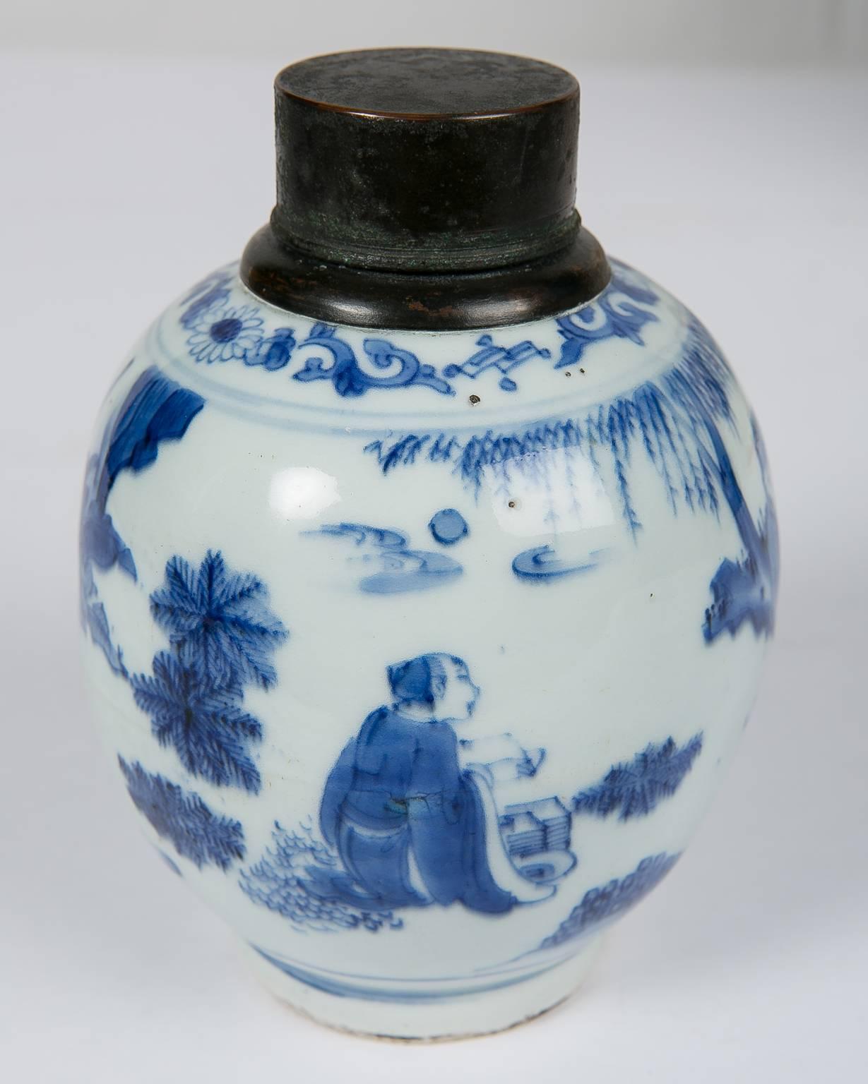 The subject of this Kangxi Blue and White porcelain tea canister is a scholar in relaxation. This kind of scholarly motif has been a time-honored subject in Chinese decorative arts. As seen on this porcelain, the decoration features a boy attendant