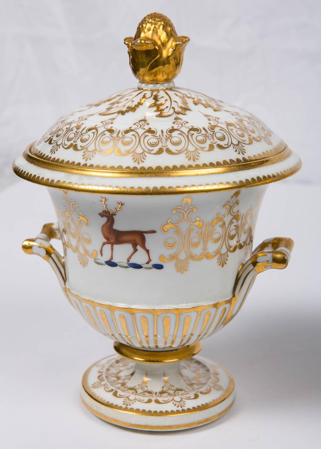 A pair of Chamberlain Worcester porcelain tureens with armorial crests.
What makes these tureens so beautiful is the lavish gold gilding on the finials, on the oak leaves around the finials, and on the gilded design of scrolling vines around the