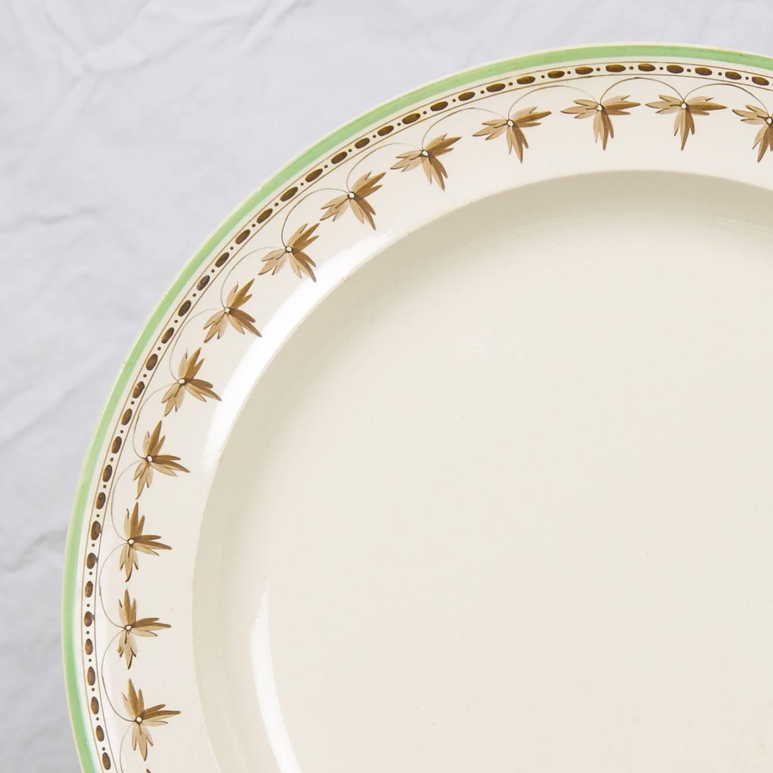 A set of 16, 18th century  creamware dishes the borders decorated with a beautiful brown necklace design, highlighted by a delicate green painted edge.
The dishes measure 9.75 inches diameter.
The condition is excellent.
The price for the 16 dishes