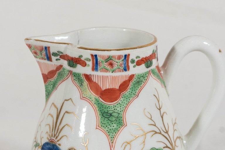 A rare 18th century Worcester cream jug painted with lappet-shaped panels showing mythical beasts alternating with vases. This very popular pattern is known as 