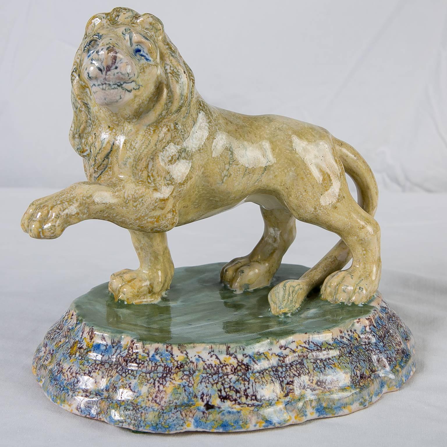 A Dutch Delft model of a lion. This rare 18th century Delft lion is naturalistically modeled. Shown striding forward with an outstretched paw. While most lions are fierce this one has a particularly friendly face and whimsical expression.
Lions
