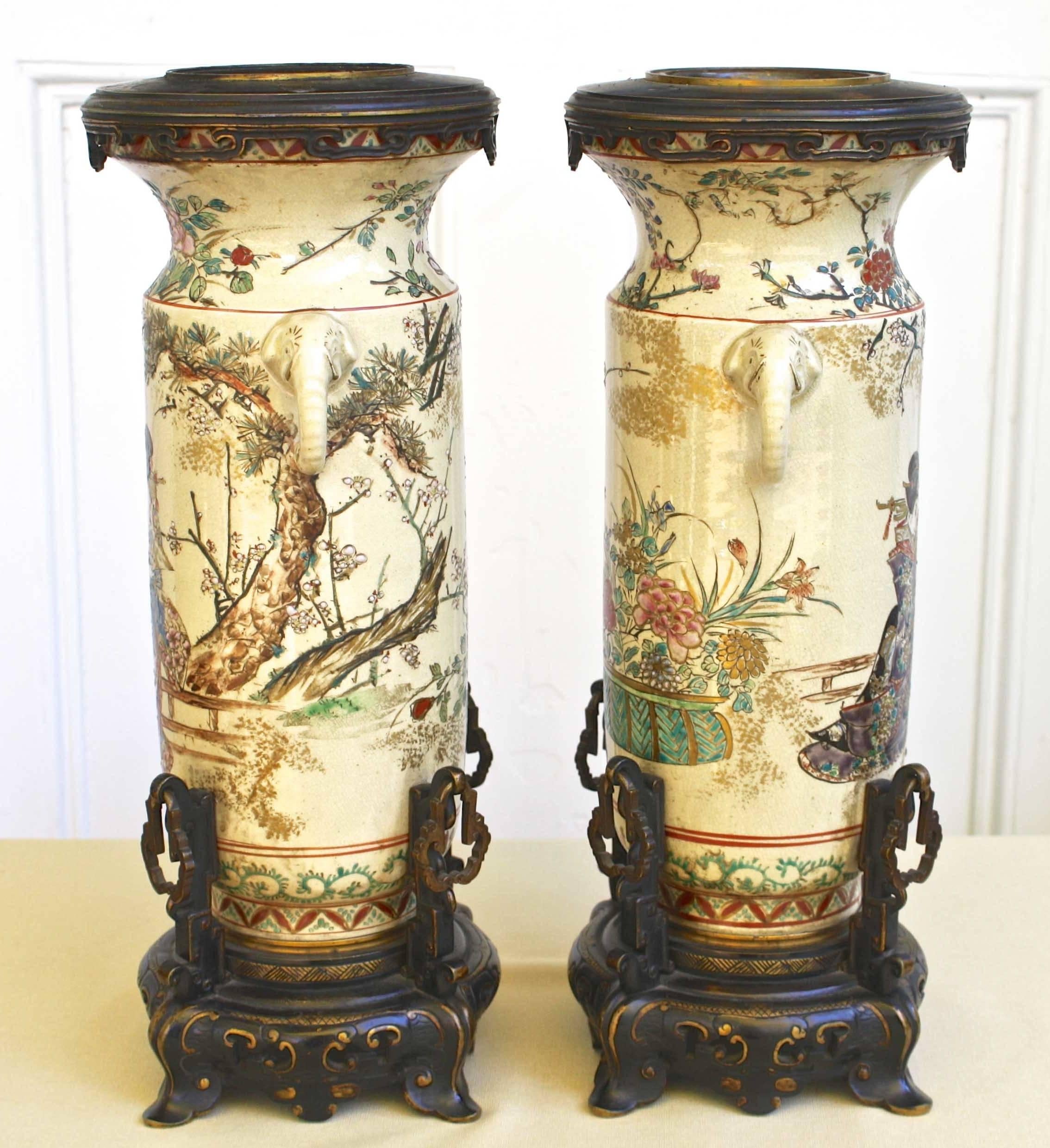 Meiji Period (1868-1912) from one of the finest Japanese makers for export to the European market; a pair of bronze-mounted intricately hand-painted earthenware vases.  As shown in Image #9, each contains an interior metal European marker: 