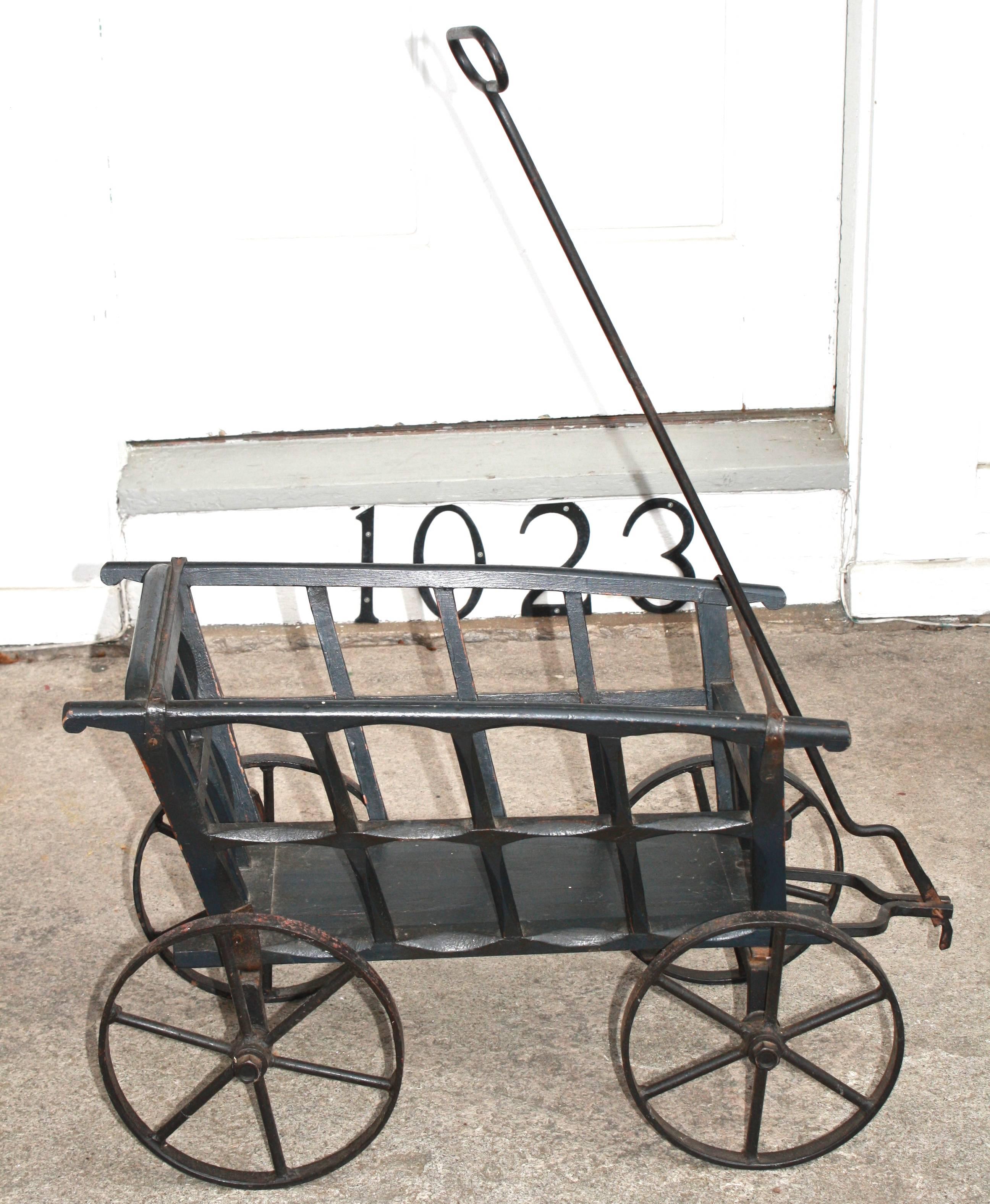 In the style of Gilded Age gardening paraphernalia at country houses in the late 19th and early 20th centuries, a small decorative utility wagon for gathering and transporting cuttings from a flower garden. From an 'East End' Long Island