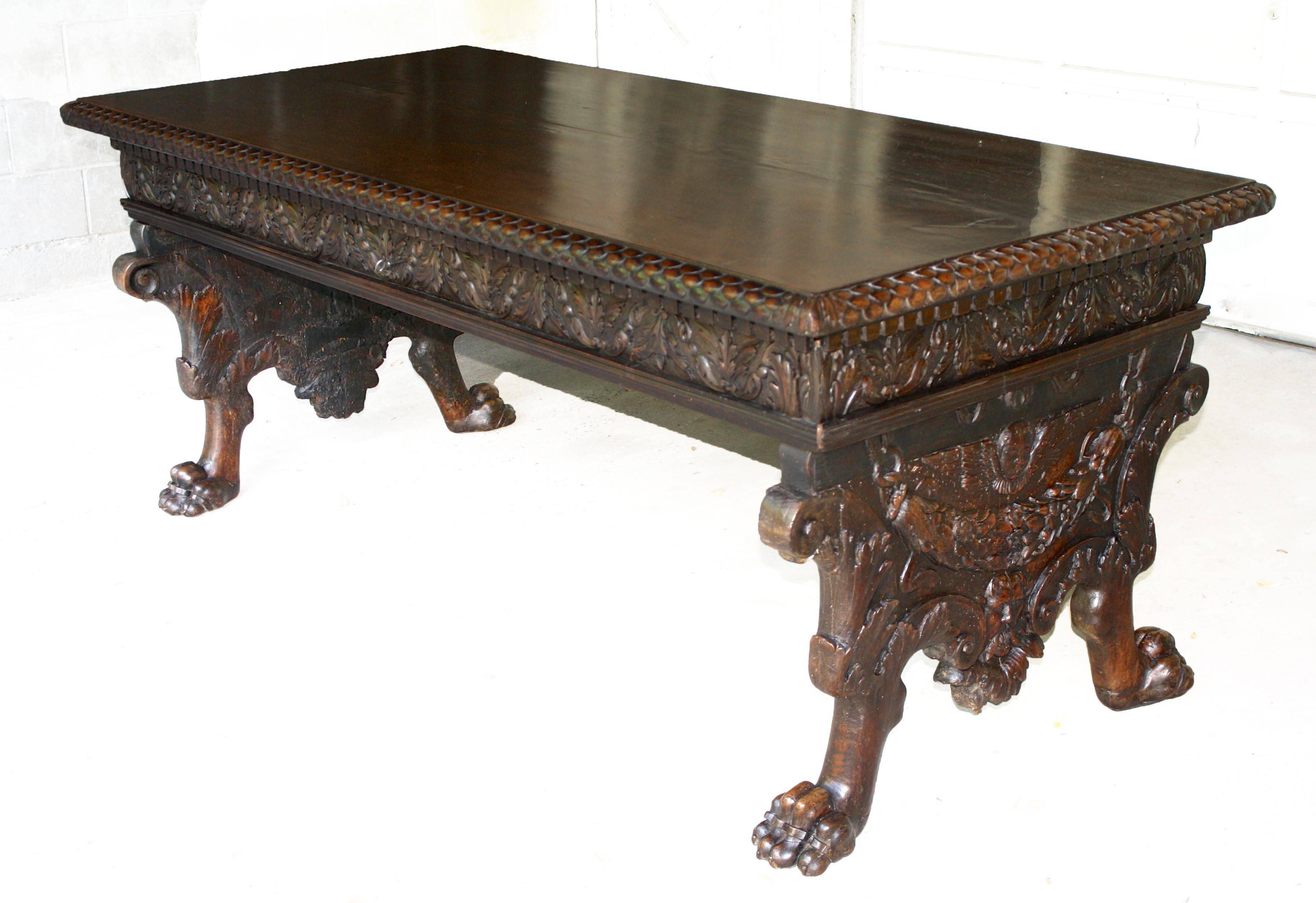 An ornately hand-carved Nord Ovest 'Piedmontese' region Italian artifact, to the ecclesiastical taste.  A long center or console table for placement in a great hall, salon, or as a 'standing desk' in a library.  Detailed trestle-end carvings of