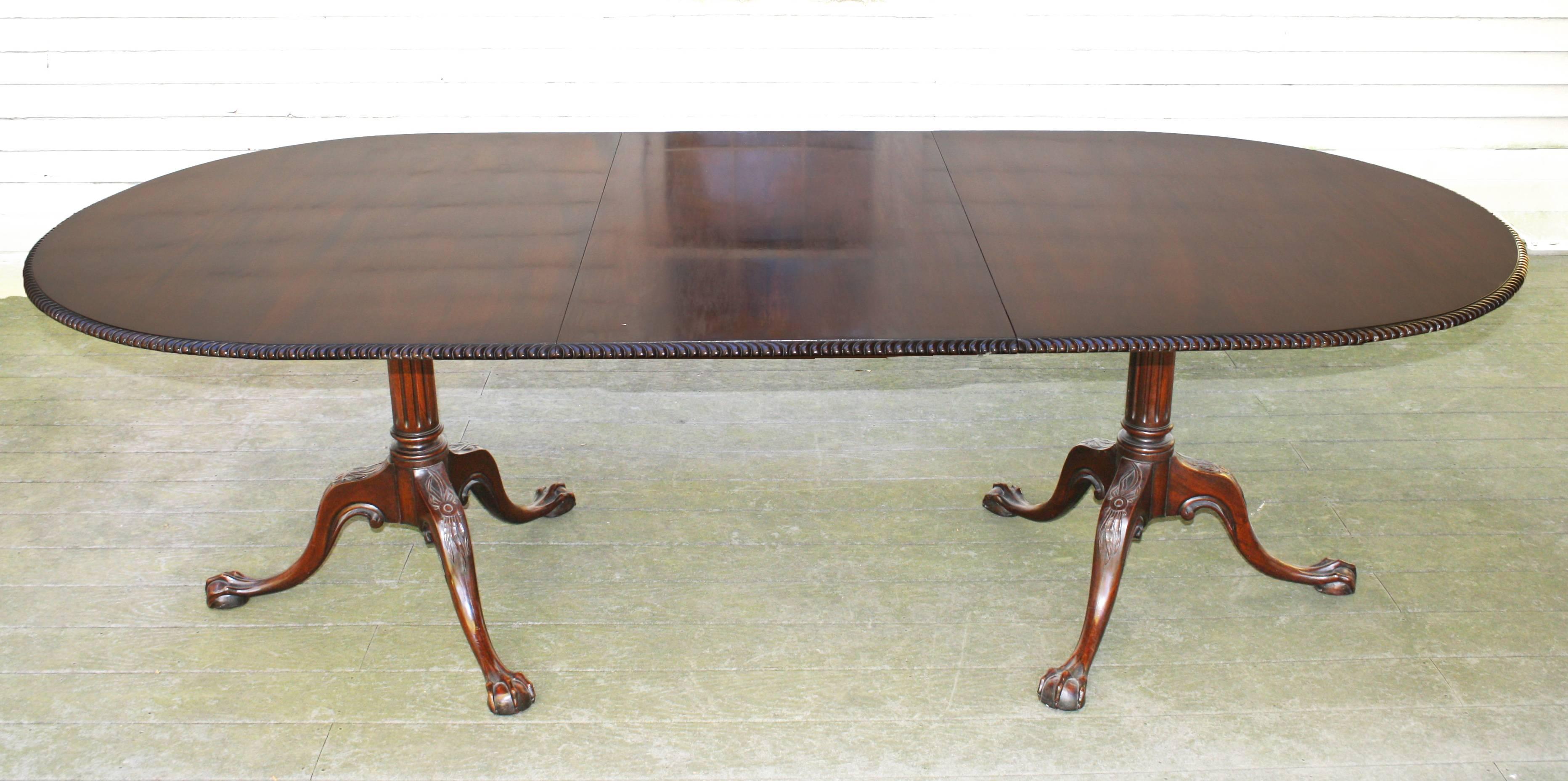 Late 19th century bench-made Chippendale Revival Cuban mahogany double pedestal dining table. With the single 24