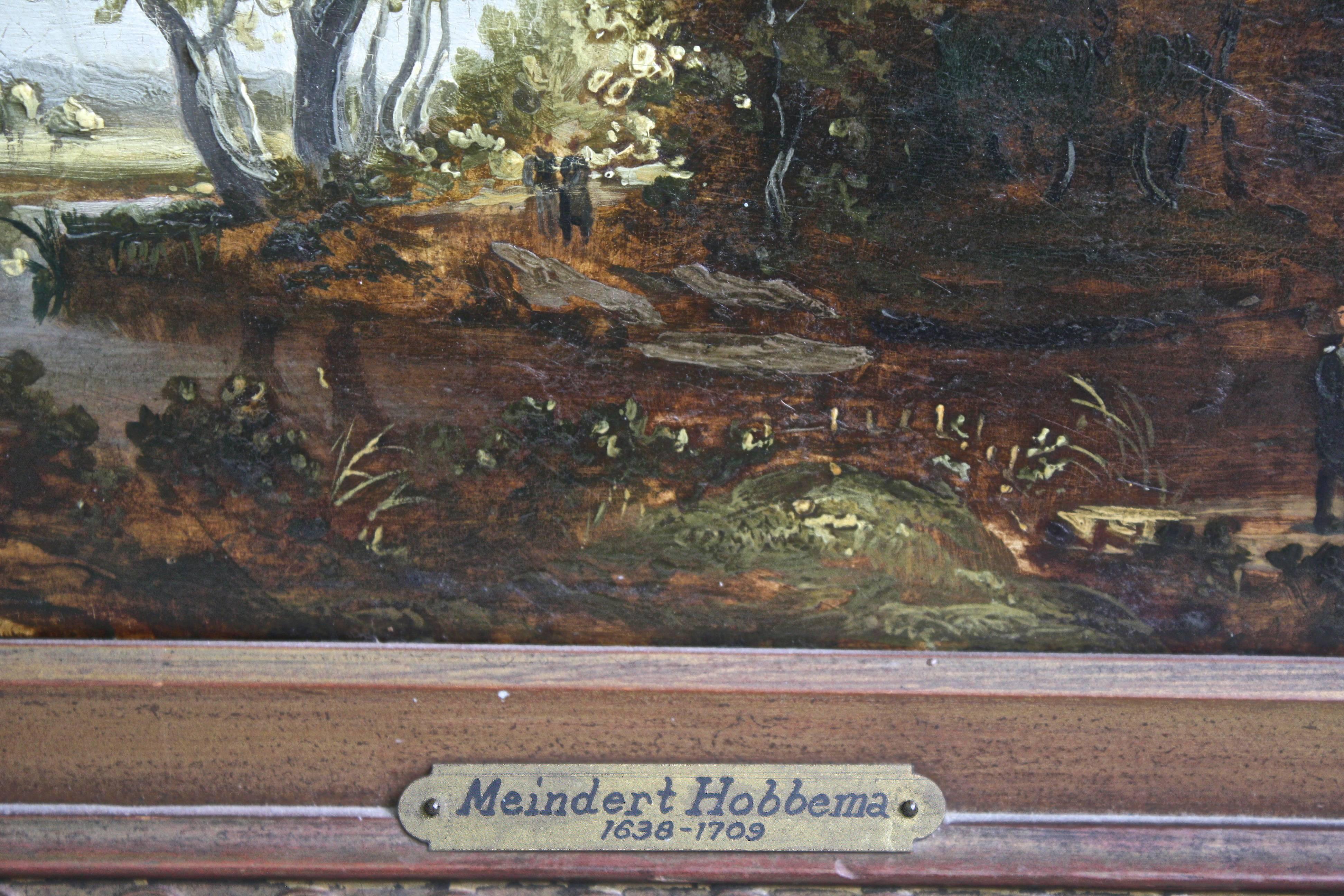 An oil-on-wood panel landscape of the wooded shores of a wetland in the Netherlands; showing figures in a boat and two separate couples walking on opposite stream shores. The antique frame, though 'later' and not original, is attractively carved